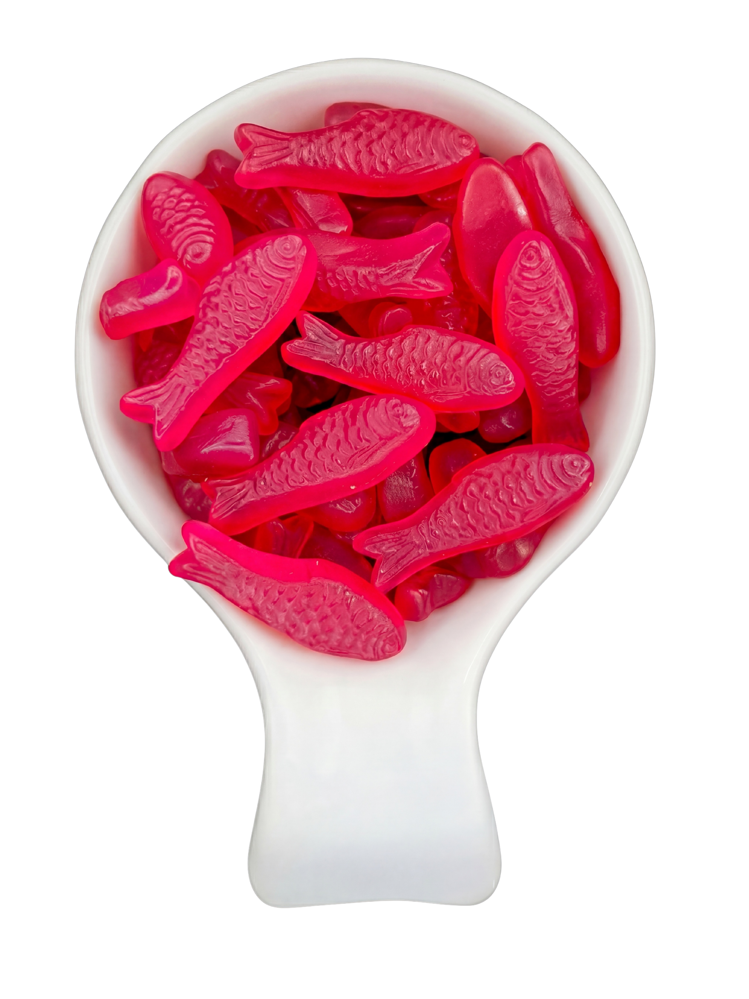 Pink gummy fish candies in a white spoon against a black background.