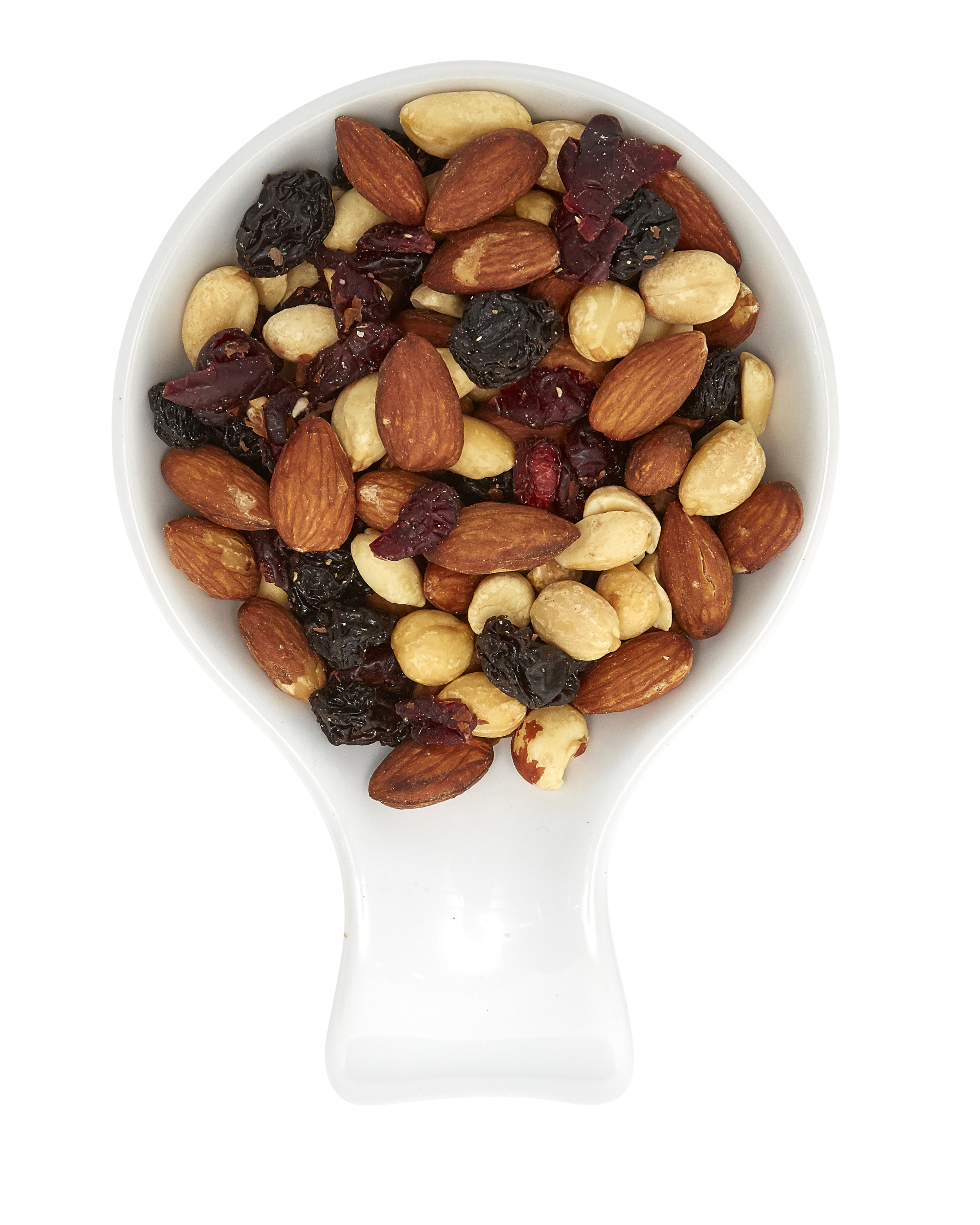 Mixed nuts including almonds, cashews, and dried berries in a white measuring scoop.