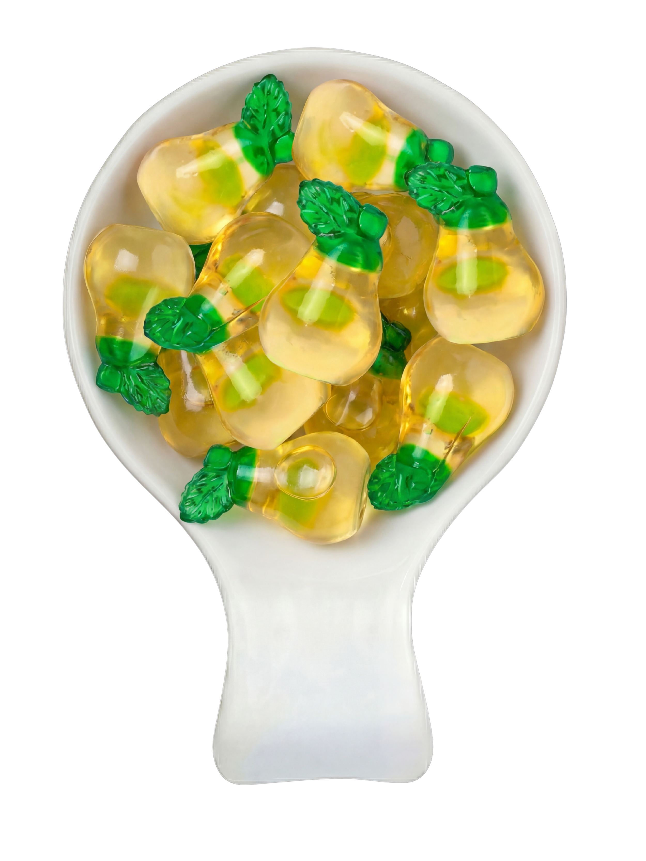 A white spoon filled with yellow gummy candies shaped like pumpkins with green leaves and stems.