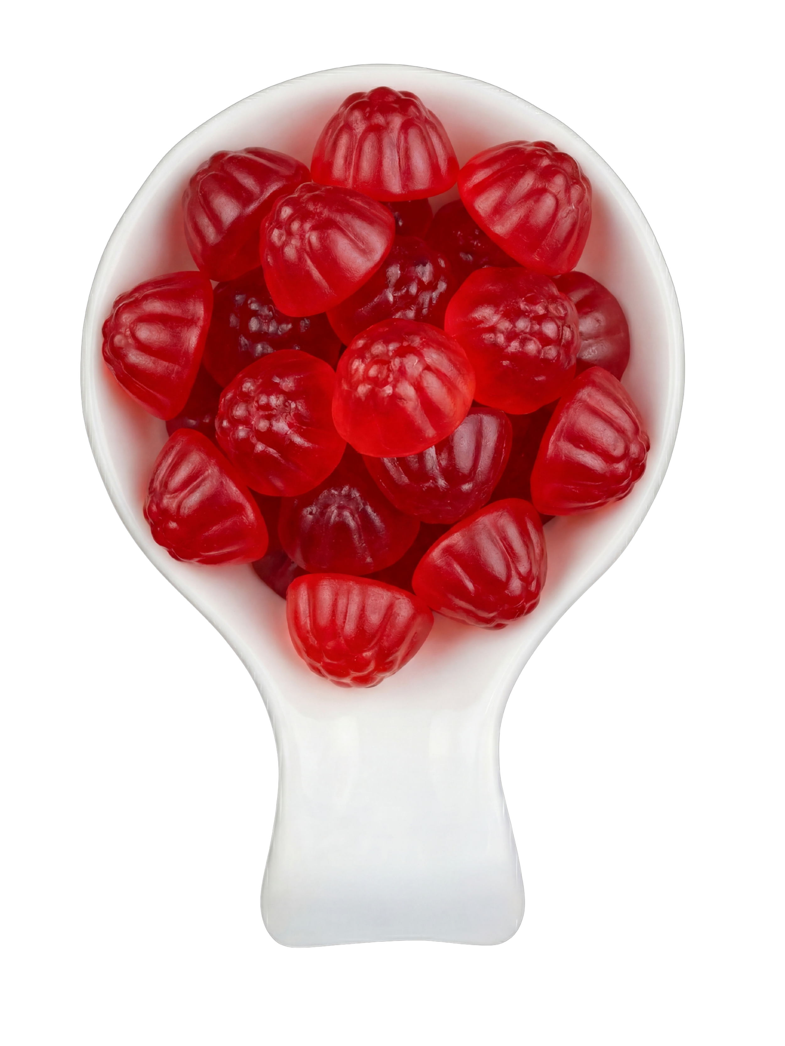 A white spoon filled with red gummy candies shaped like raspberries, isolated on a black background.