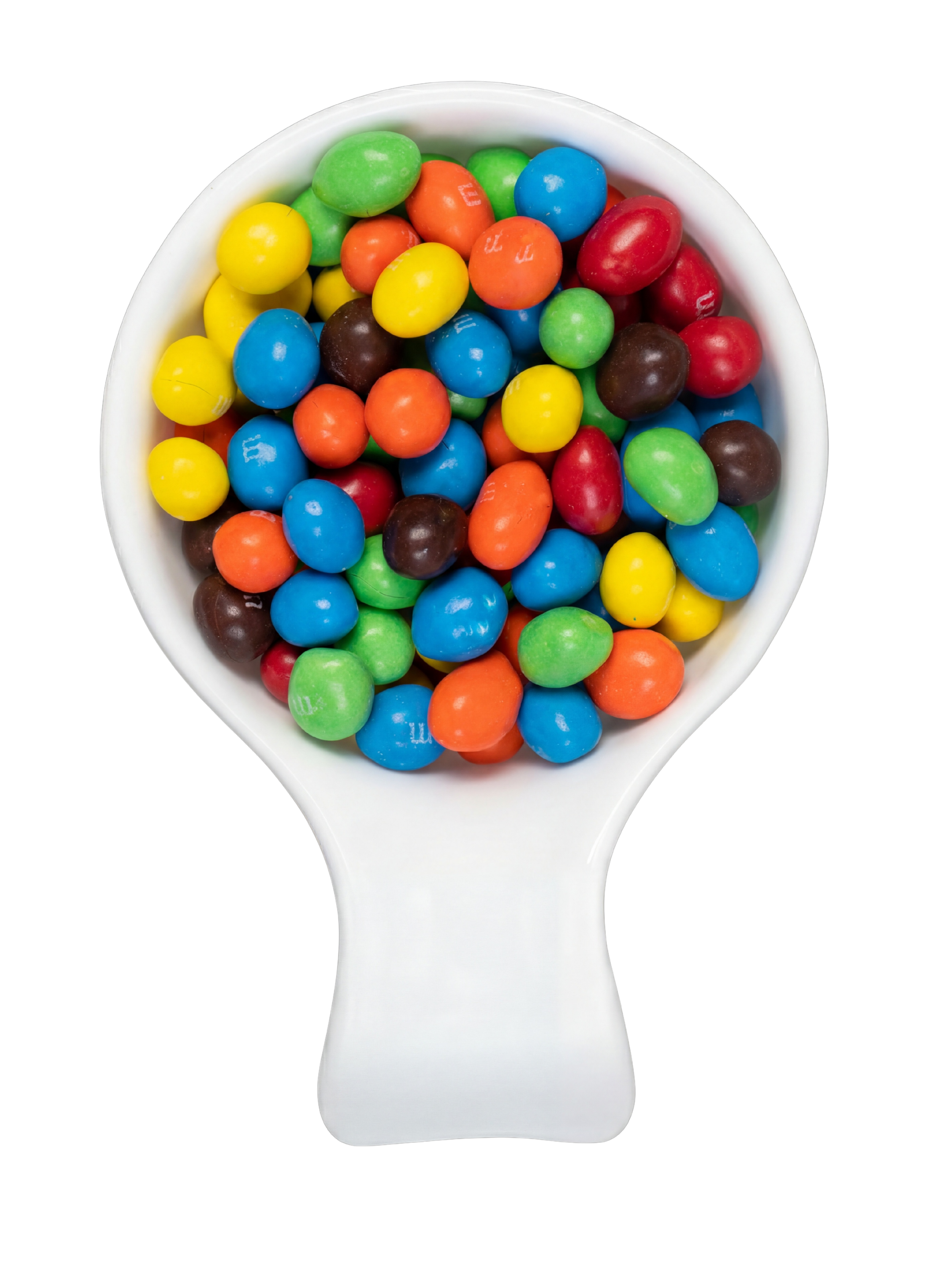A white spoon filled with colorful candy-coated chocolates, including yellow, blue, red, green, orange, and brown, against a black background.