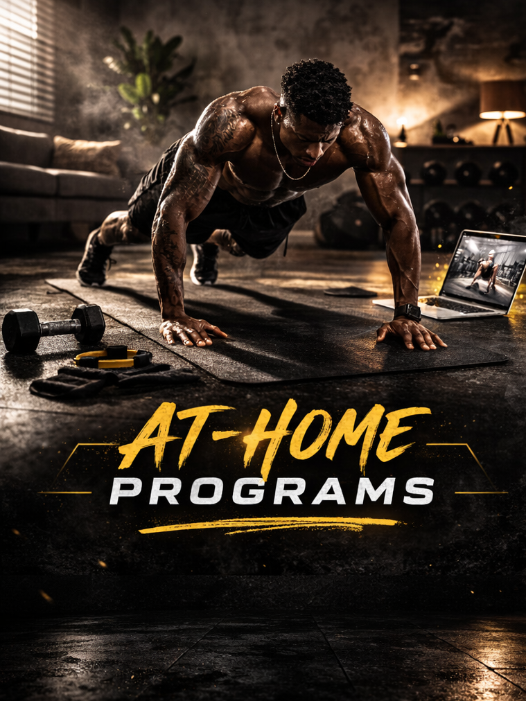 A muscular man doing push-ups on a yoga mat in a home gym, watching a workout video on a laptop.