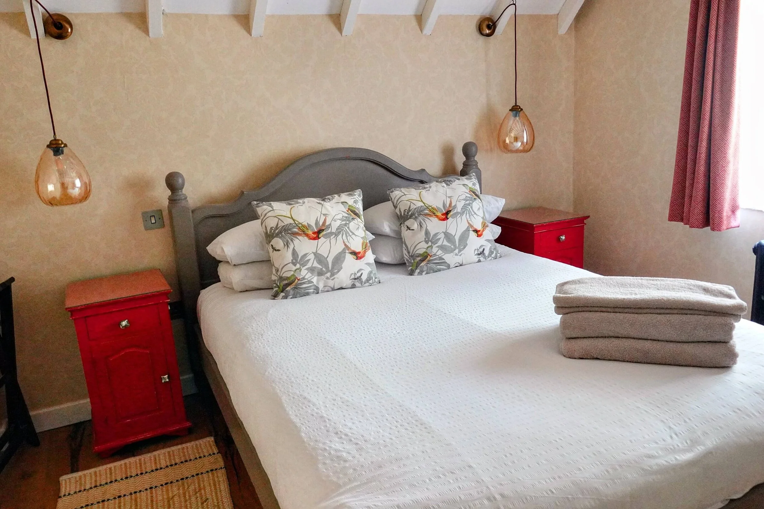 Peaceful double bedroom at The Snuggery with luxury linens and countryside retreat styling.