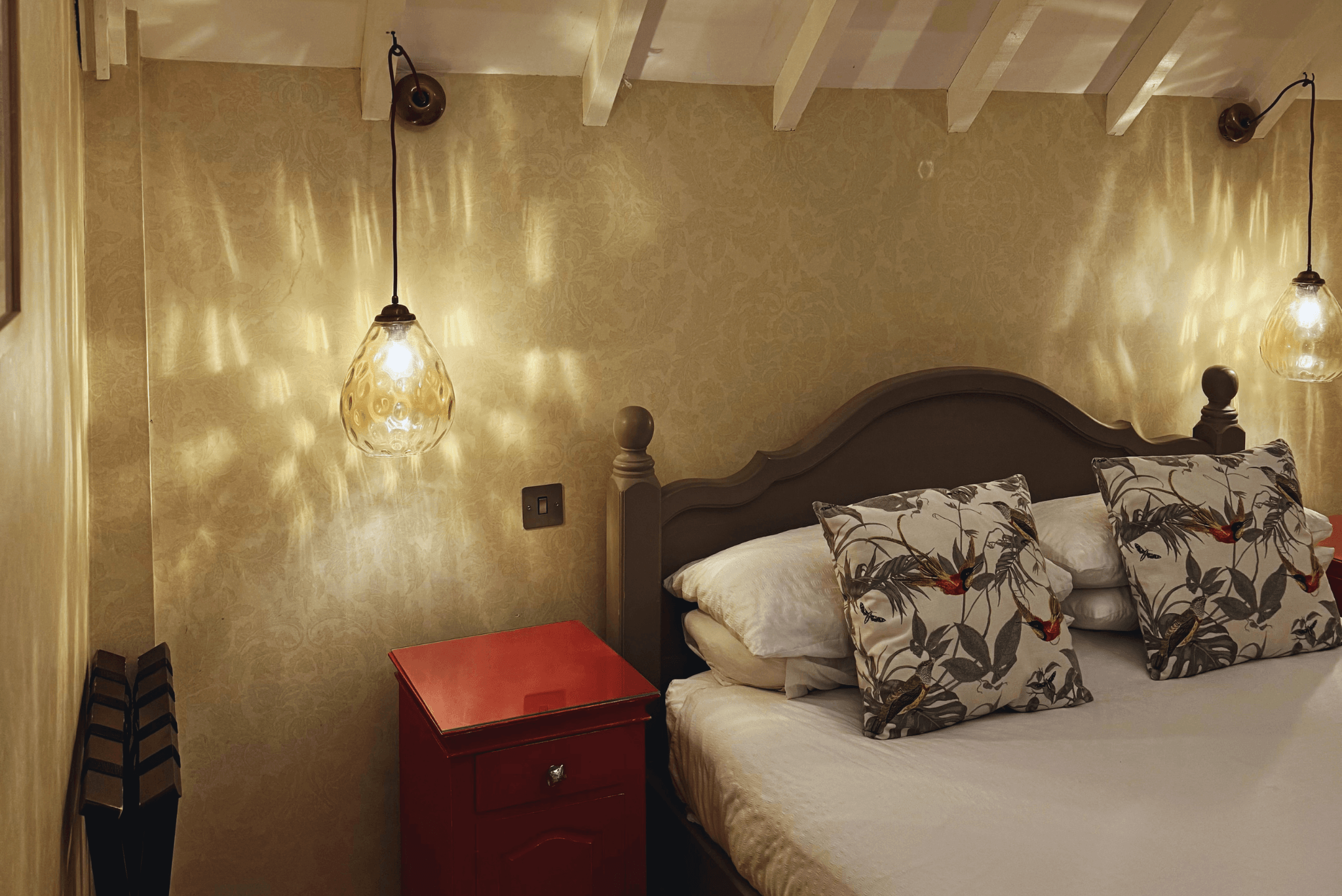 Character bedroom with warm lighting at The Snuggery.