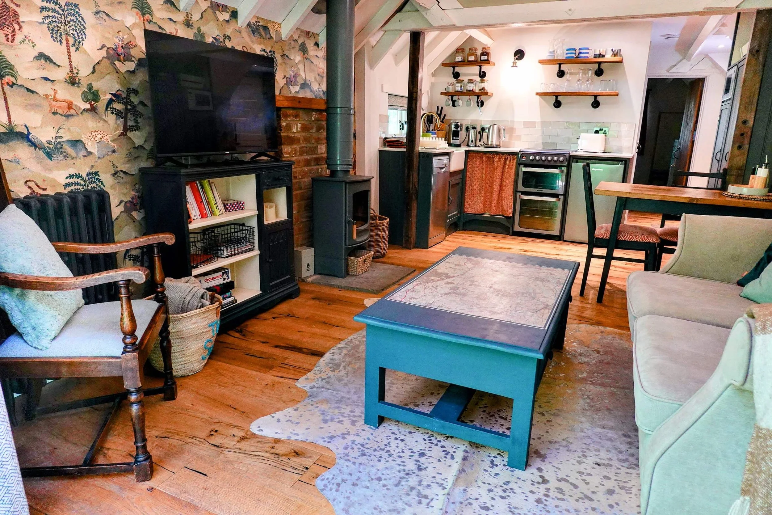 Open-plan living and kitchen space at The Snuggery, blending vintage charm with modern comforts for a relaxing countryside escape.