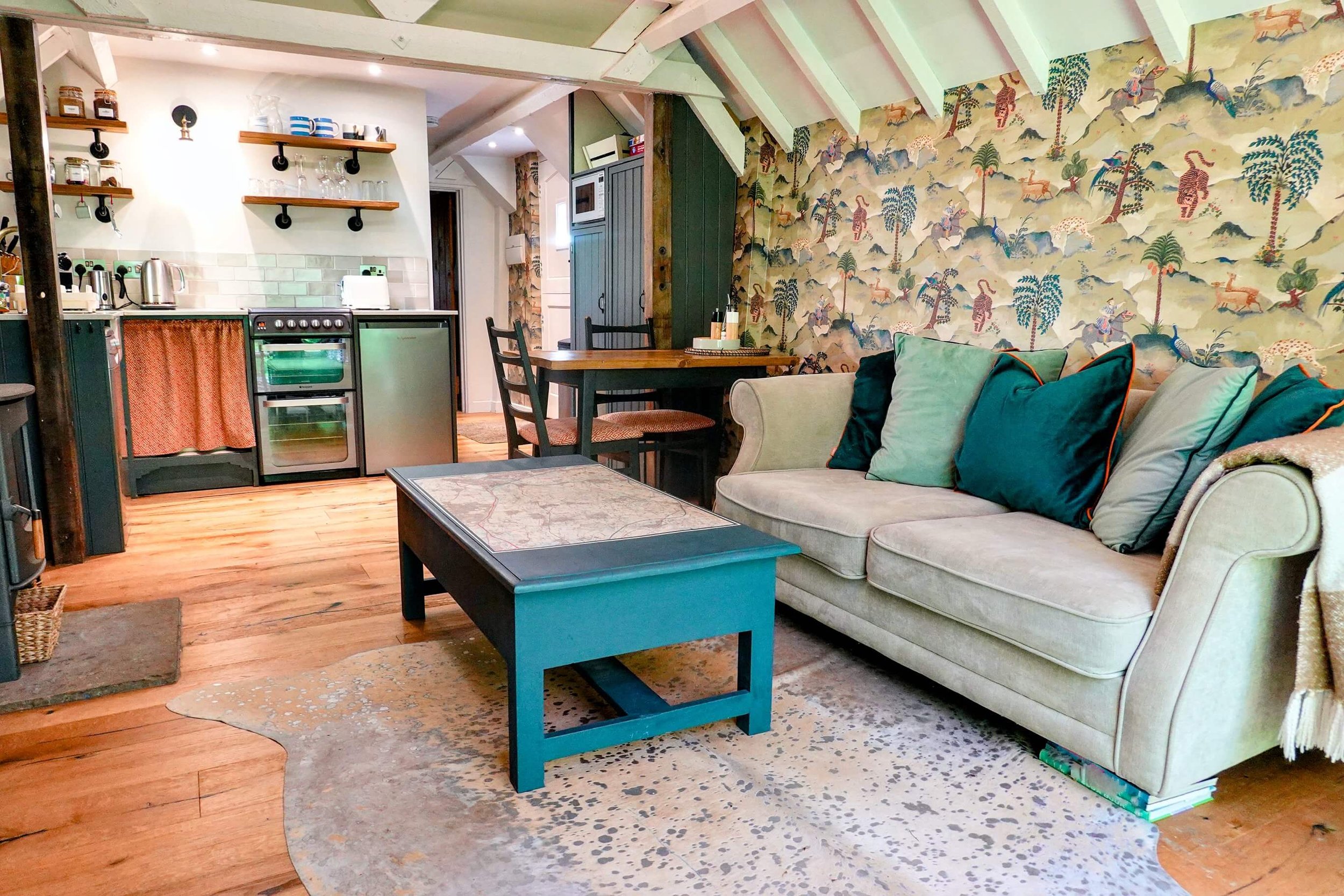 Comfortable open-plan lounge and kitchen at The Snuggery, designed for relaxing countryside escapes.