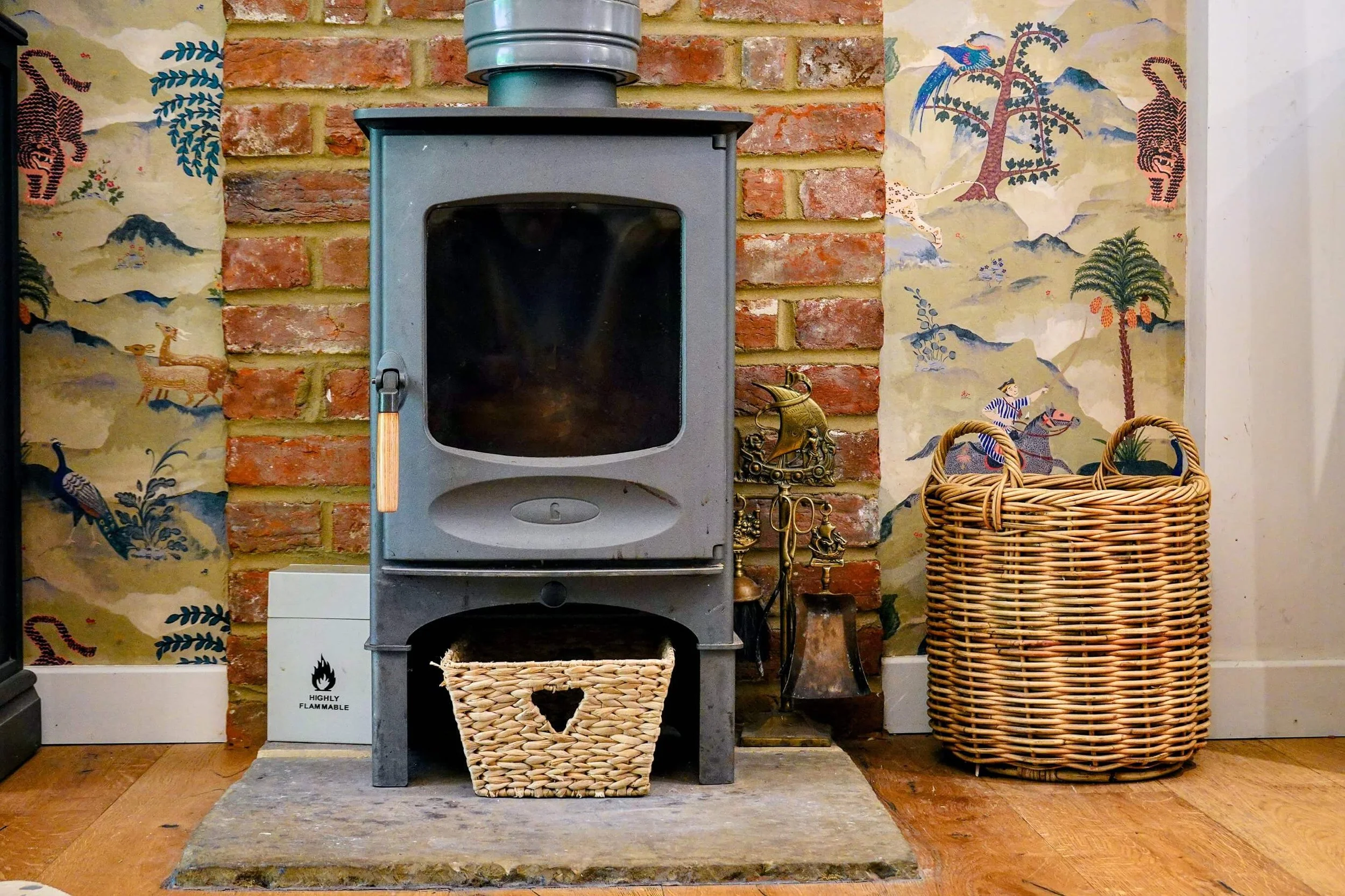 Cosy wood-burning stove creating a warm and inviting atmosphere at The Snuggery.