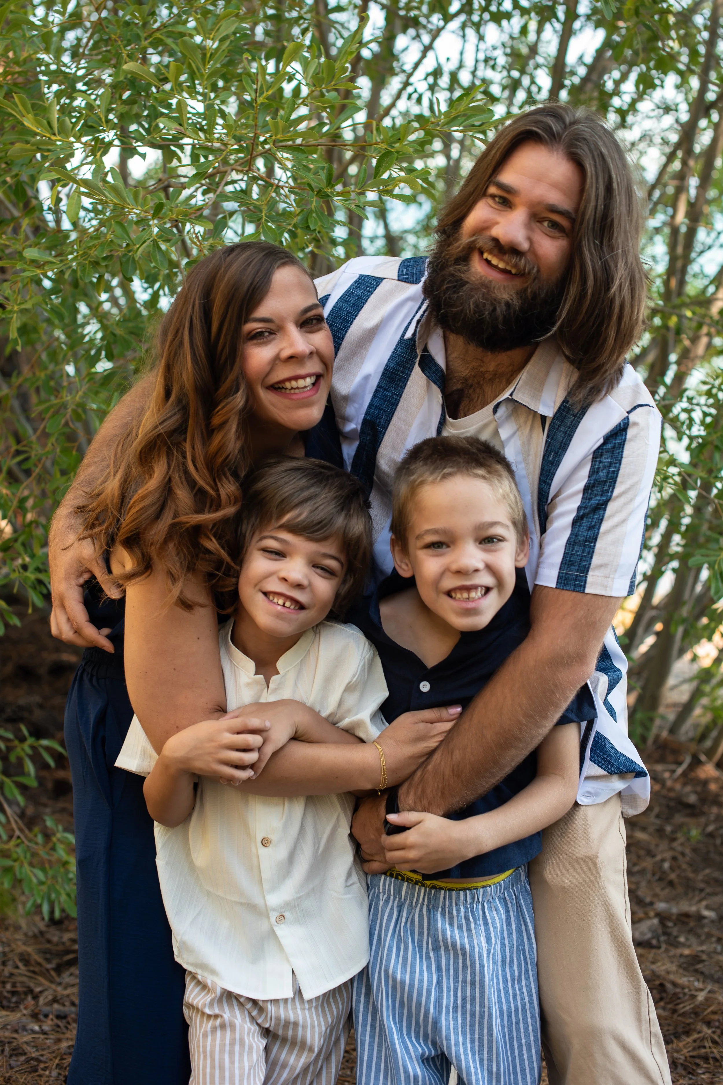 Family group hug with mom and dad and kids
