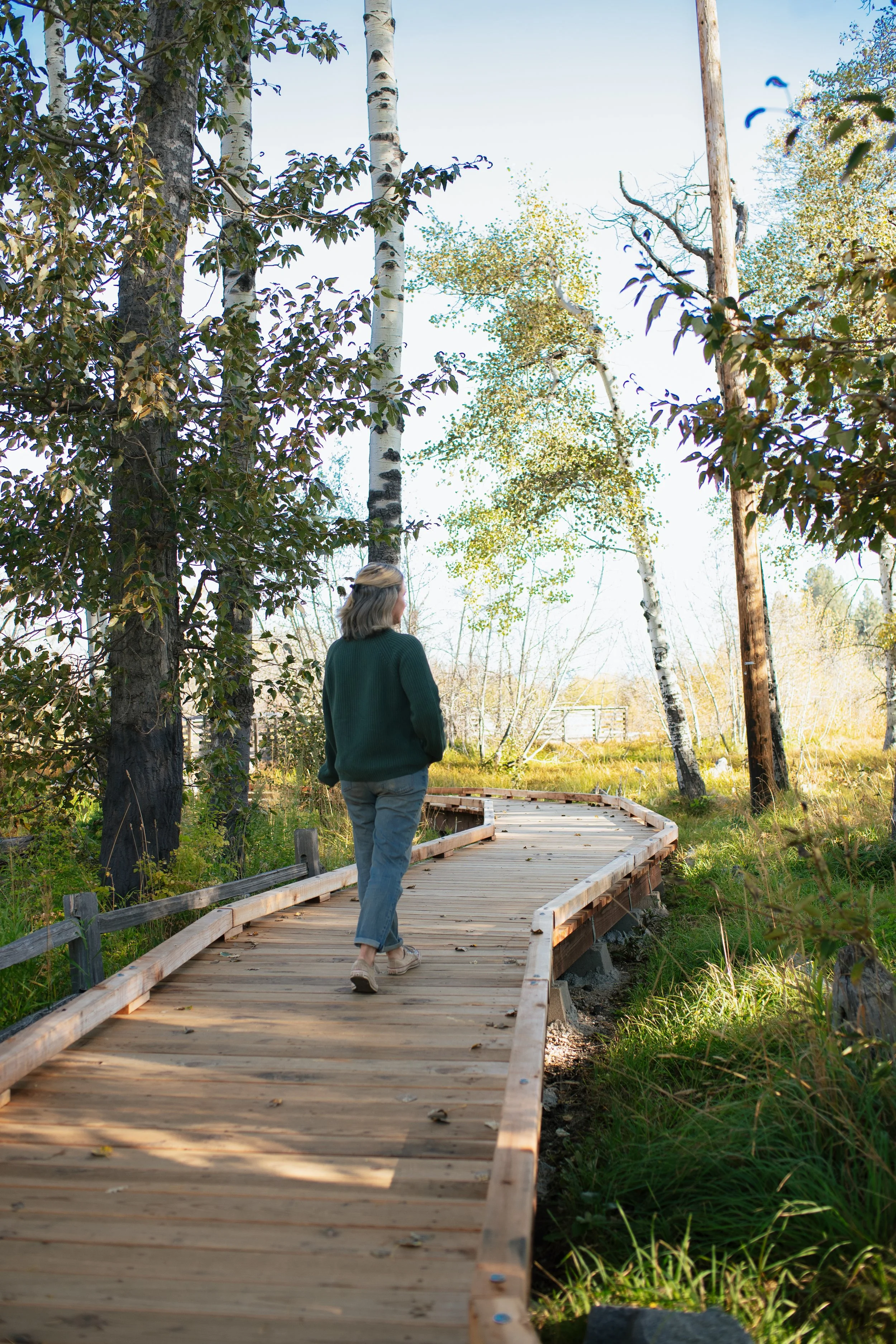 Girl walking on boardwalk at Taylor Creek