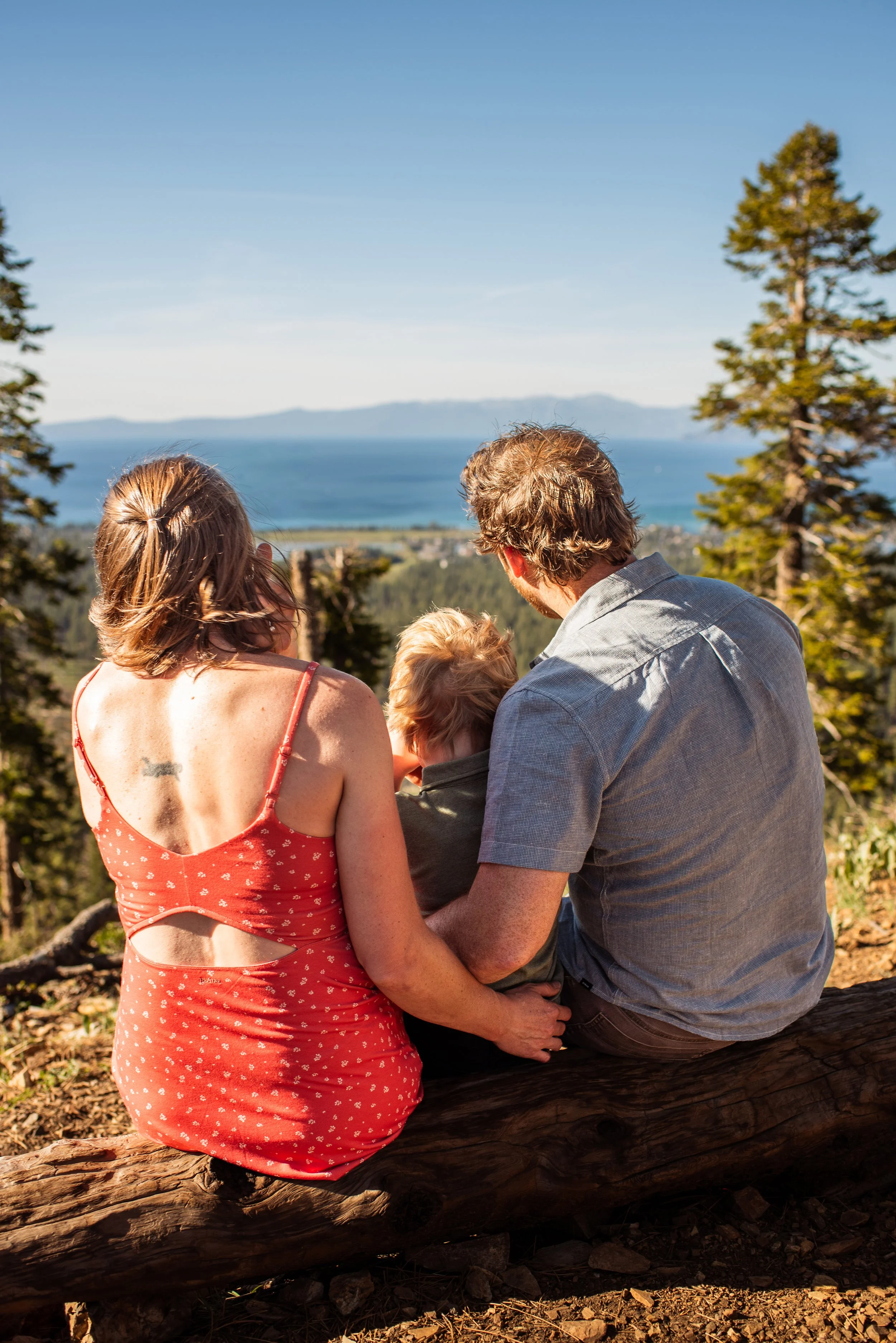 Family looking out at the view of the lake