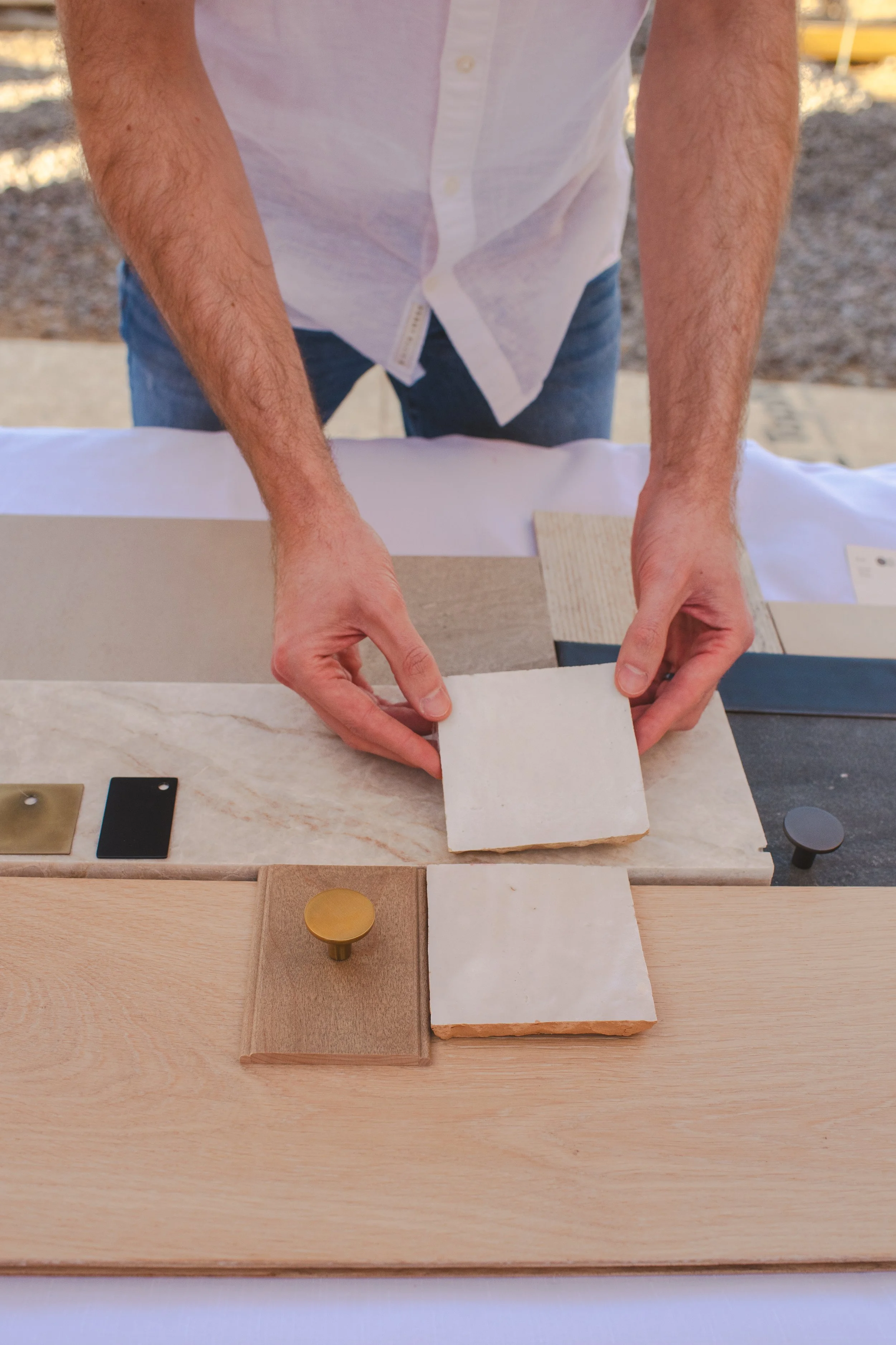 Personal Branding photo of interior designer arranging materials on a mood board