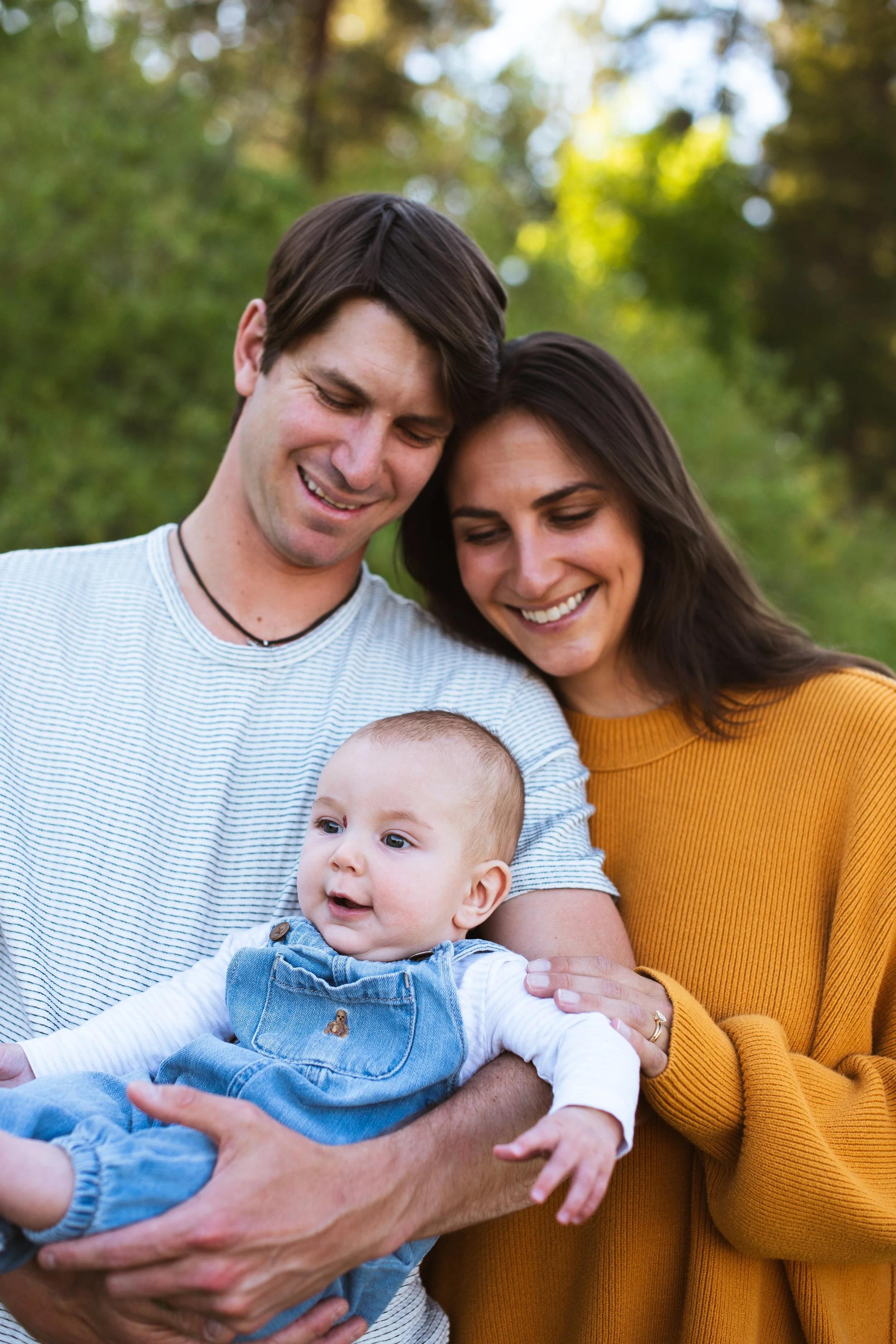 Outdoors family photo mom, dad, and baby