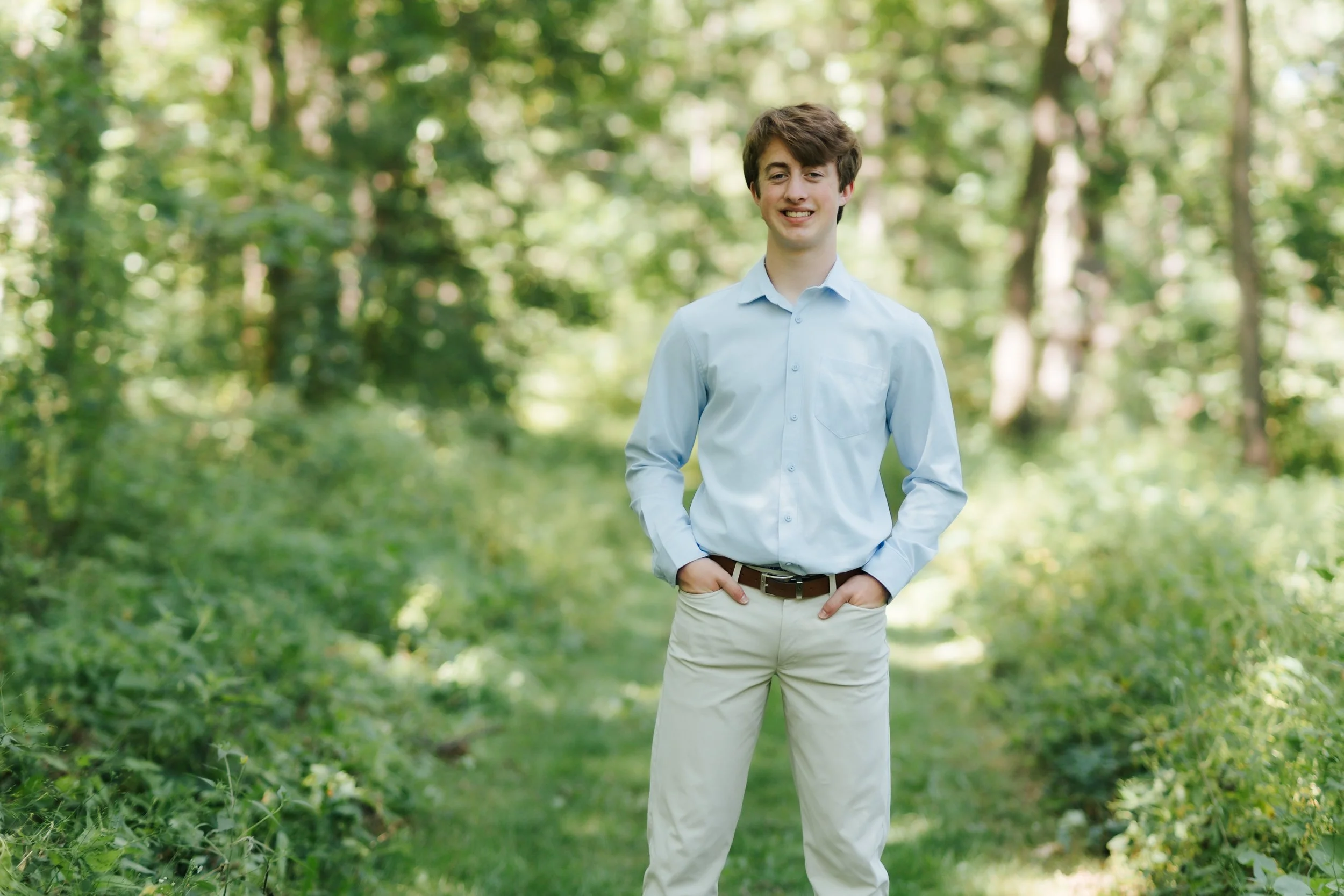 High school senior boy standing on a grass path. Anderson Farm County Park, Oregon, WI