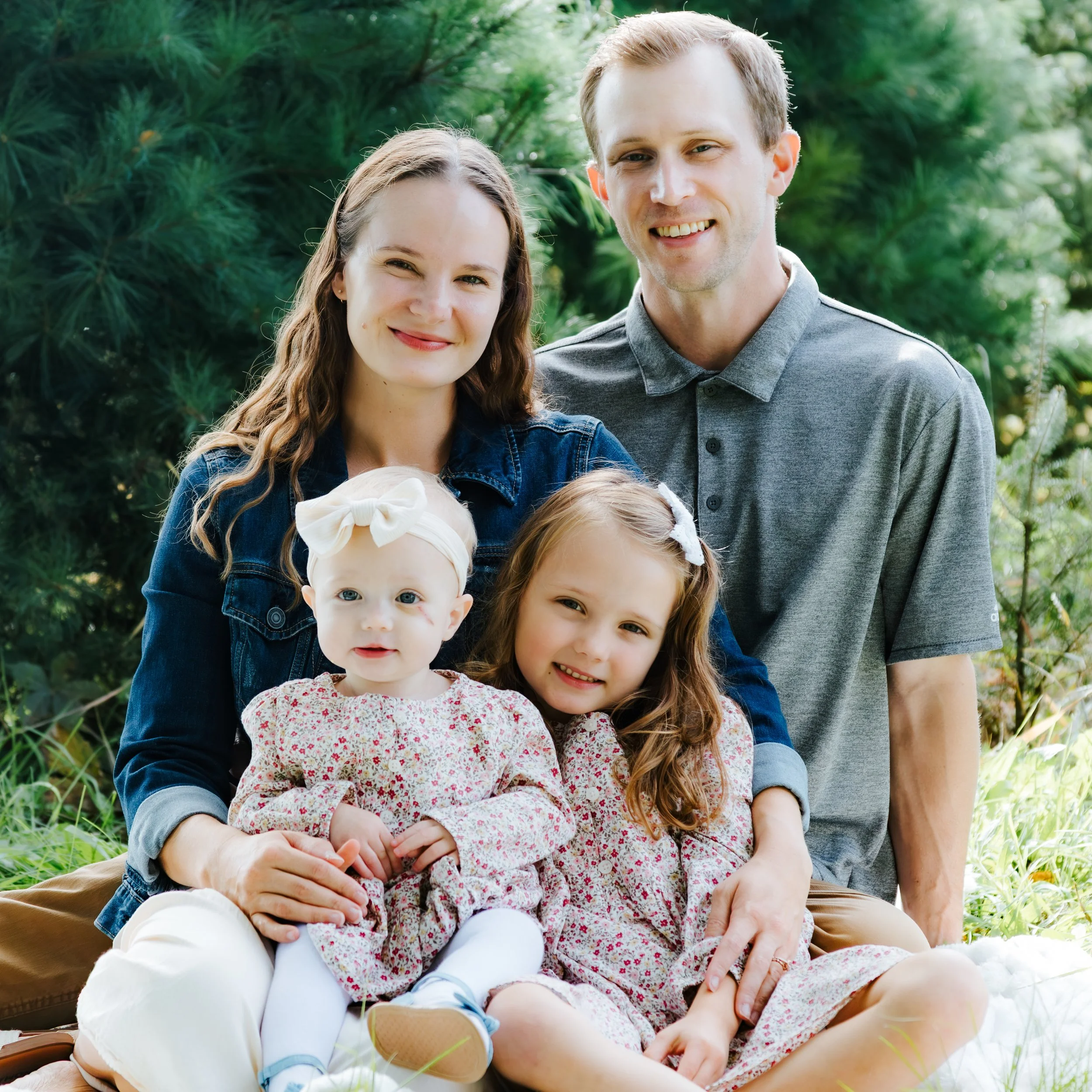 Family Christmas photos at an evergreen tree location near Sun Prairie Wisconsin.