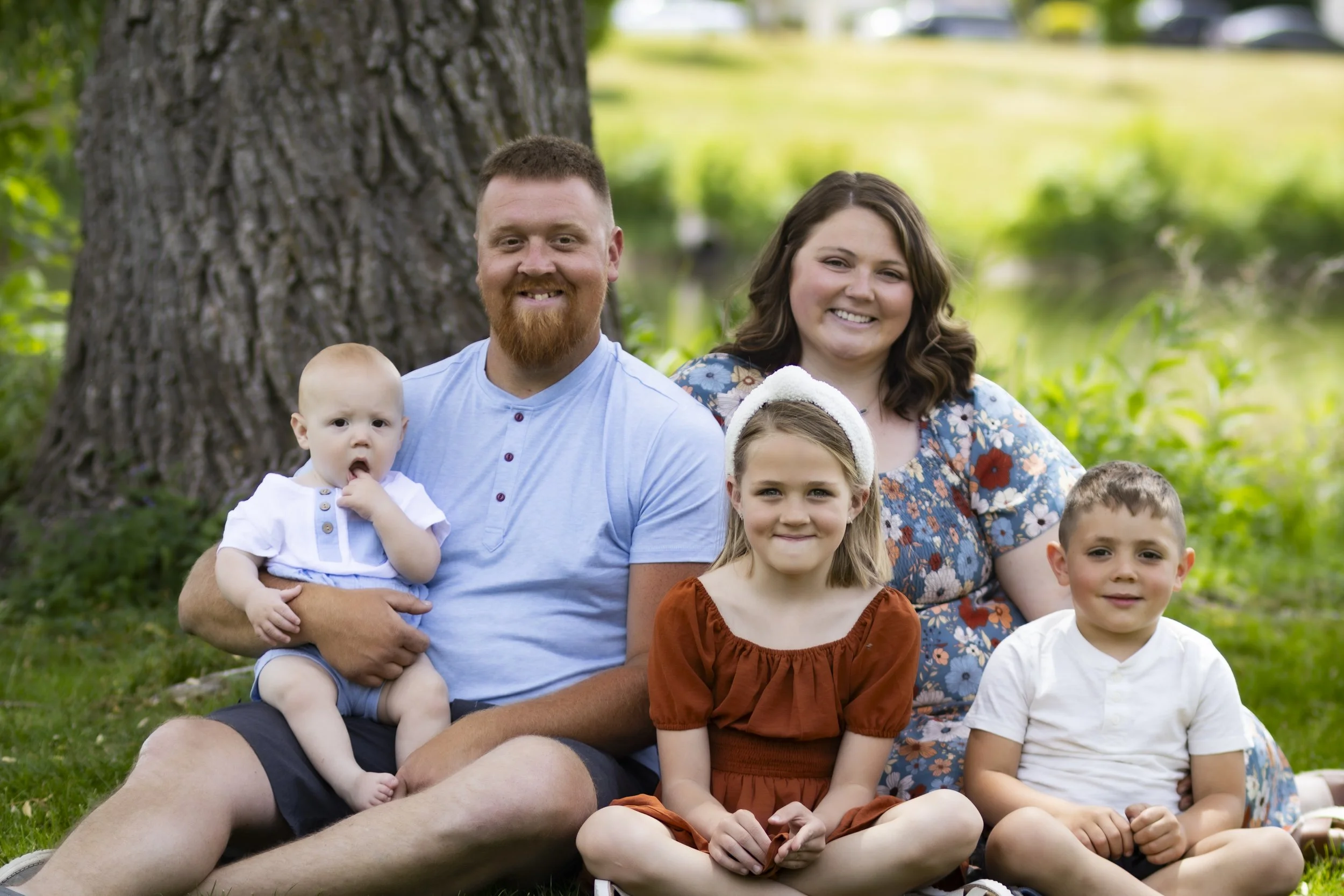 Family sitting for a moments session at Riverside Park, Watertown, WI