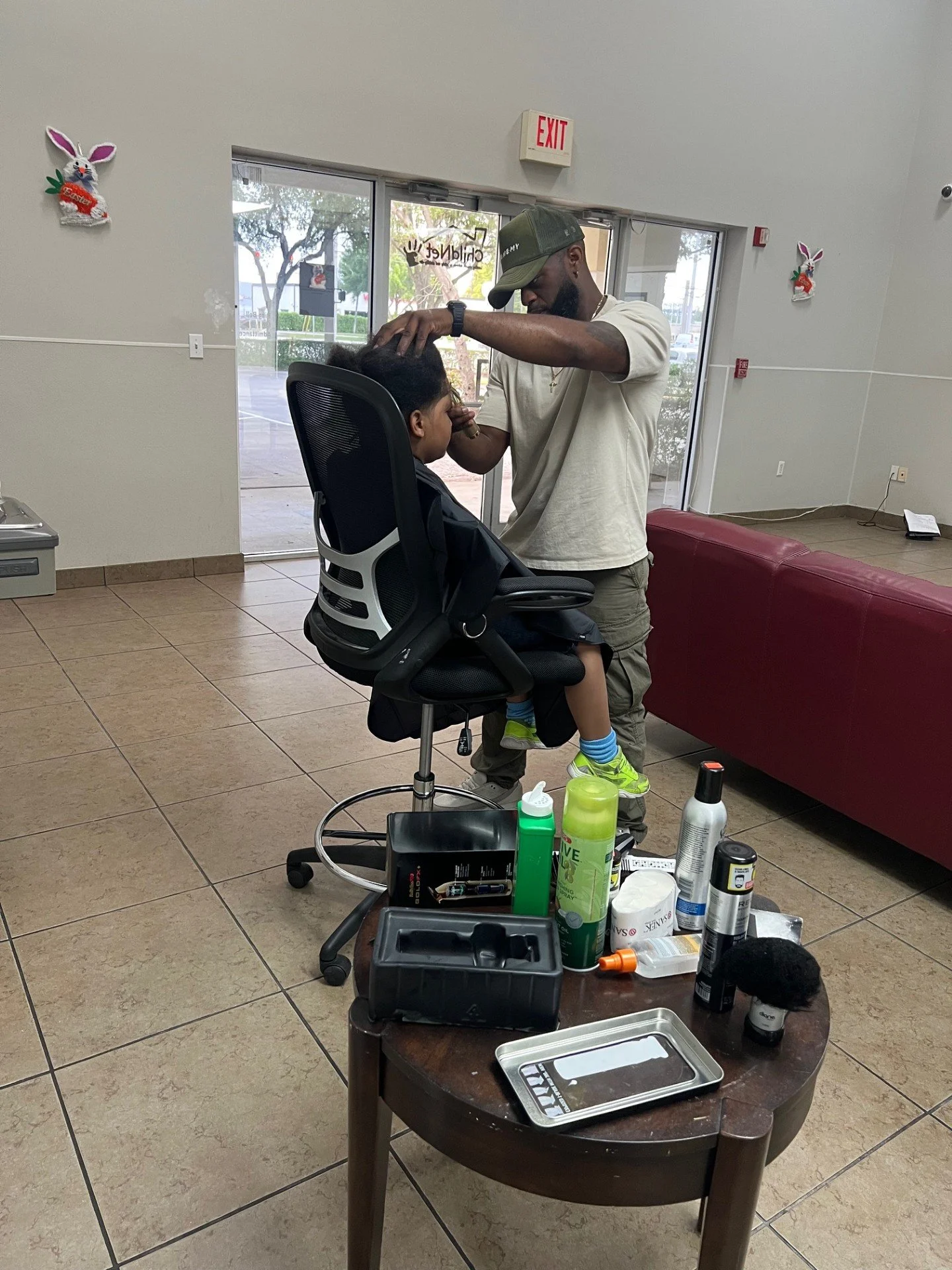Barber cutting foster child's hair
