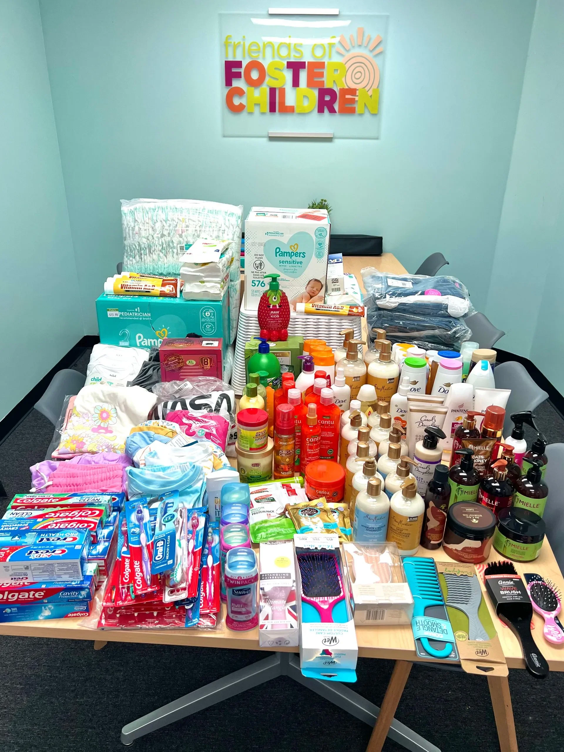 Table with stacks of toileteries and essentials for children