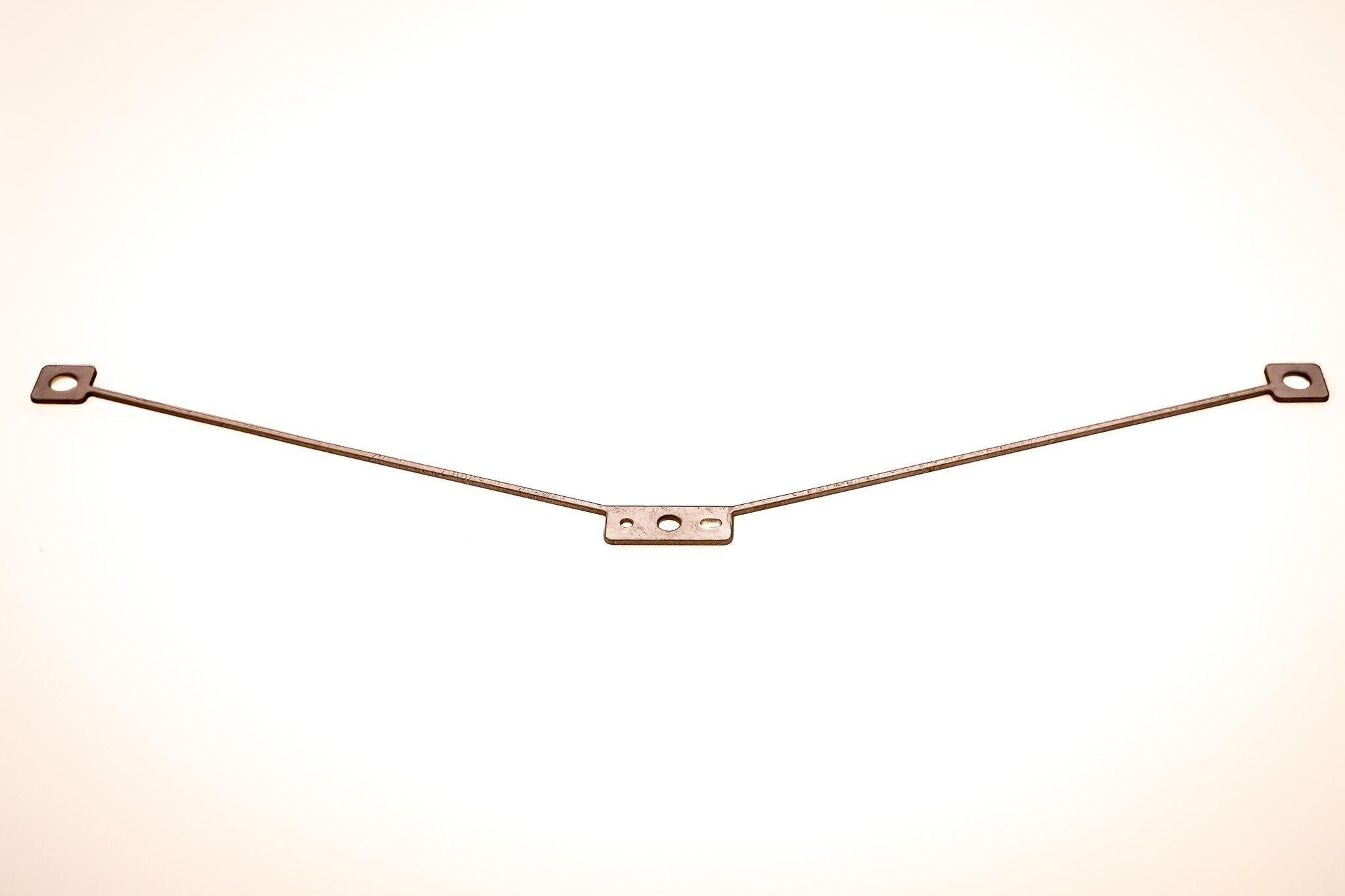 A metallic Y-shaped object with three holes, each at one end and in the middle, on a plain white background.