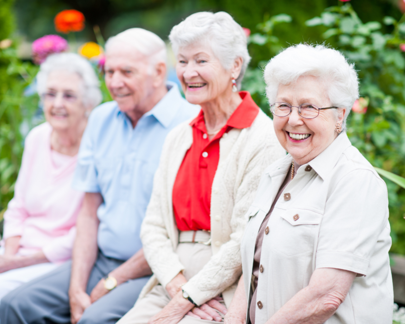 Older adults enjoying conversation outdoors, supported independence and wellbeing