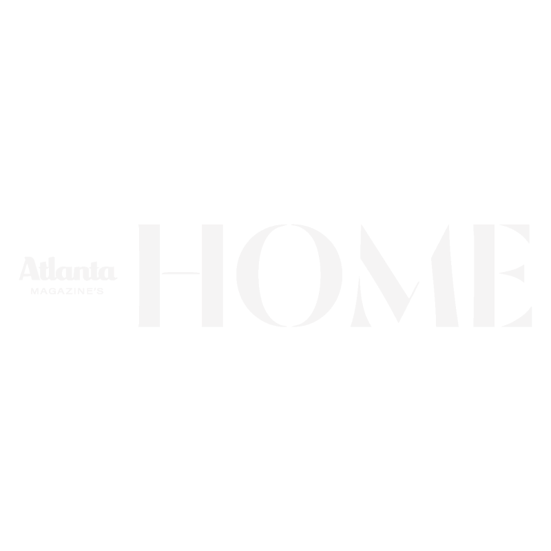 Magazine cover with large white text reading 'H O M E' and smaller text 'Atlanta MAGAZINE'S' on a black background.