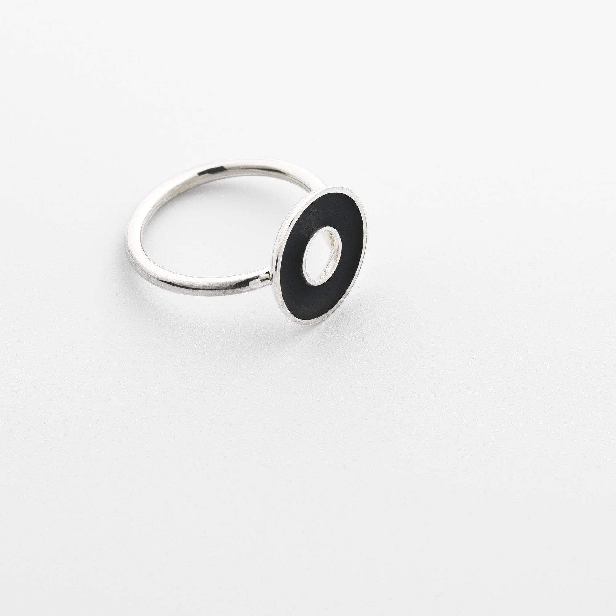 Sterling silver Orbis small ring, circular concave torus mounted on round band, polished edge and black interior