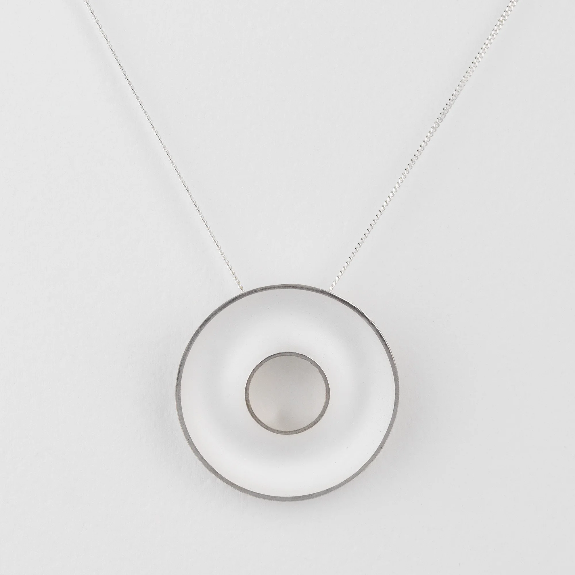 Sterling silver Orbis large necklace, concave, circular, torus pendant, polished edge and white interior on curb chain