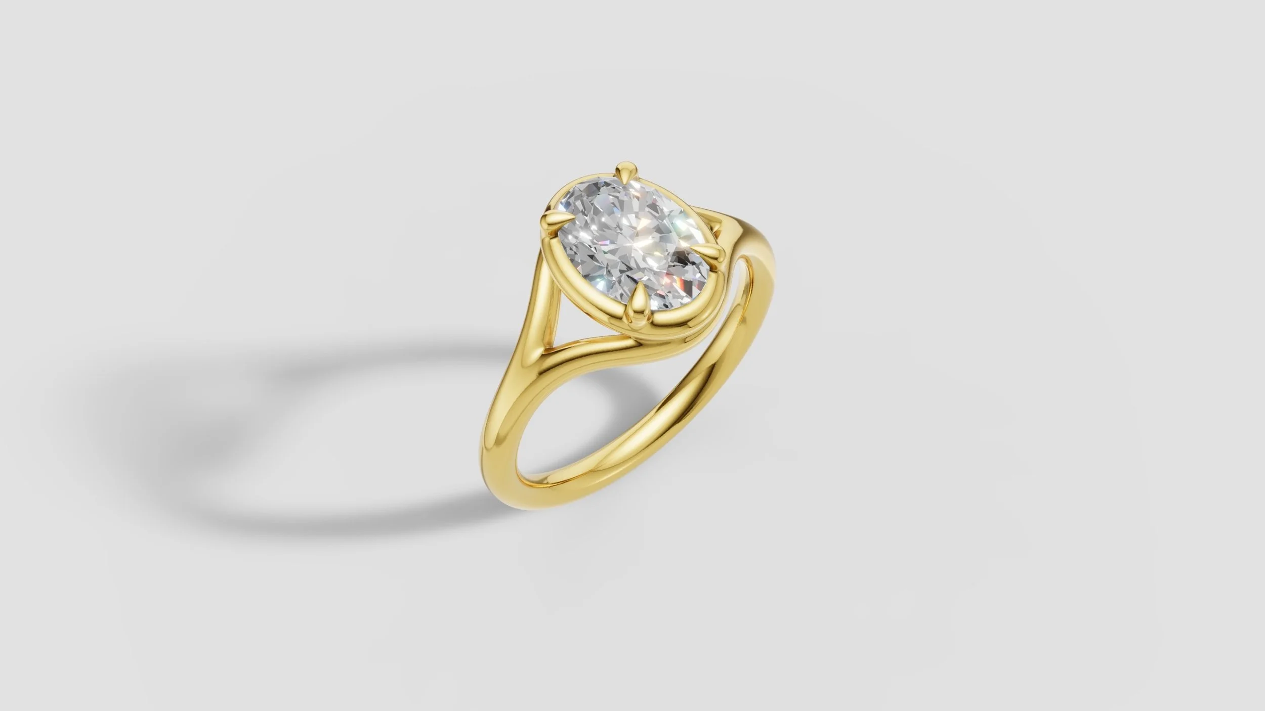 Bespoke 18ct gold engagement ring with 2ct oval diamond, split shank band and sculptural four claw setting