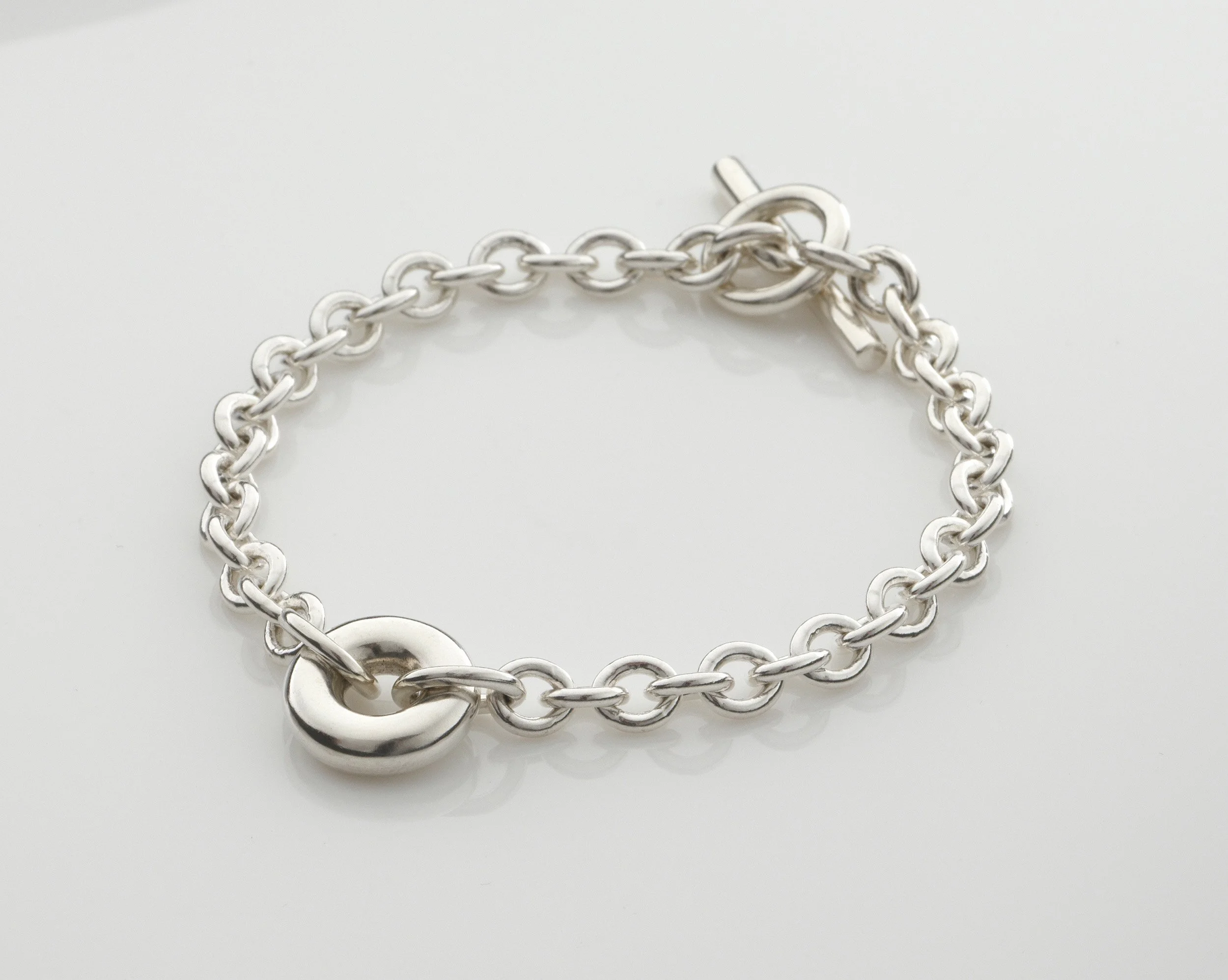 Sterling silver Monad chain bracelet, hollow torus centre link on chunky chain with T-bar clasp