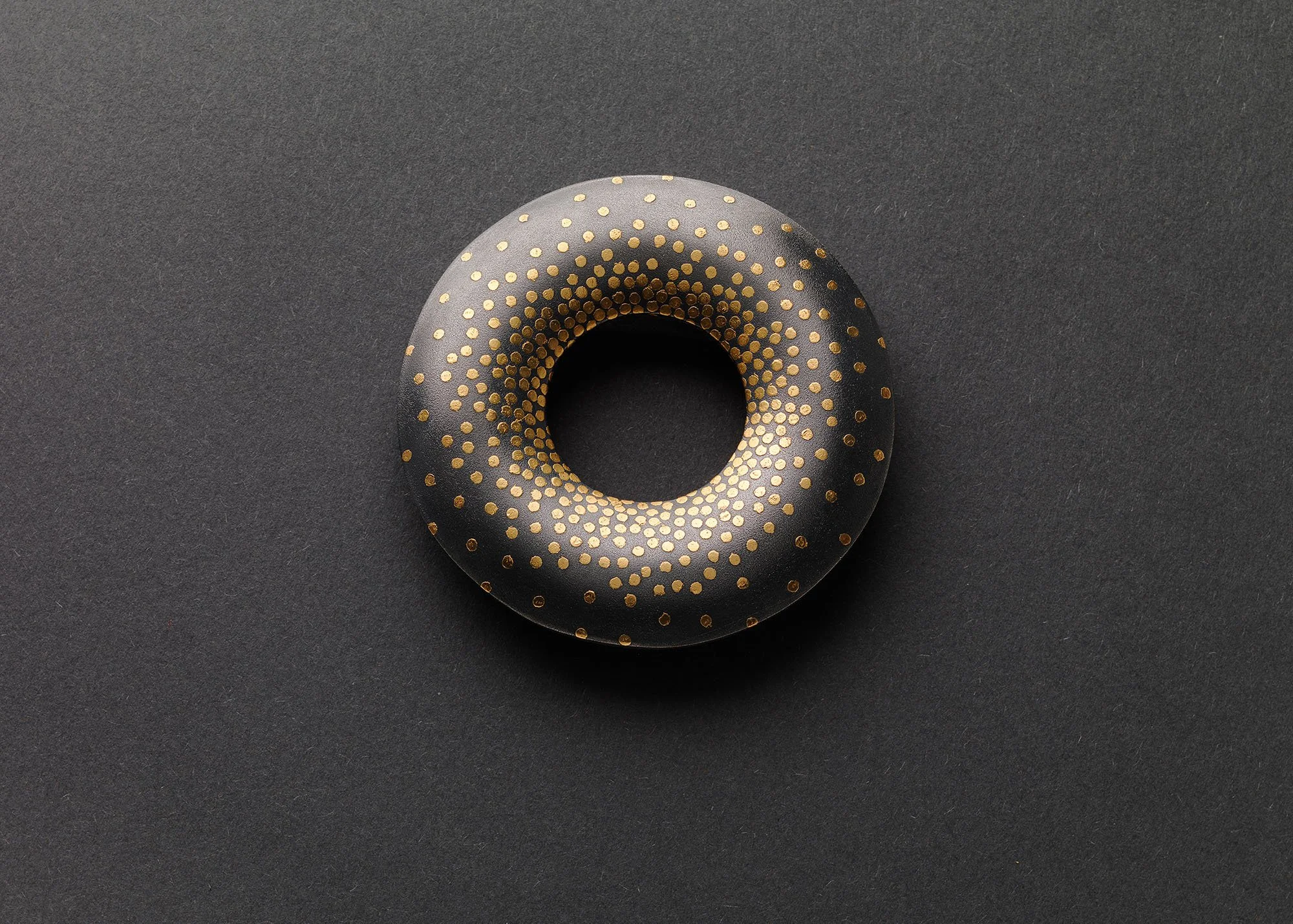 Oblivion brooch in oxidised sterling silver with keum boo gold dots in a dispersing pattern