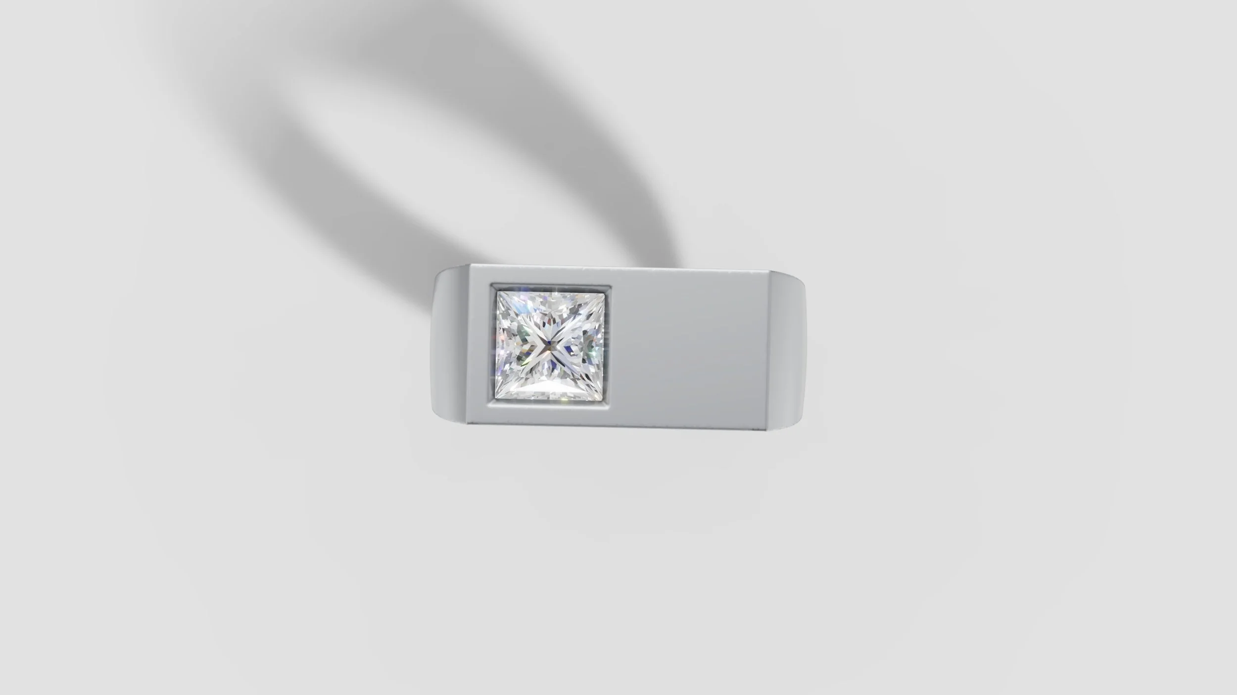 Top view of platinum signet ring with half carat princess cut diamond flush set into rectangular face.