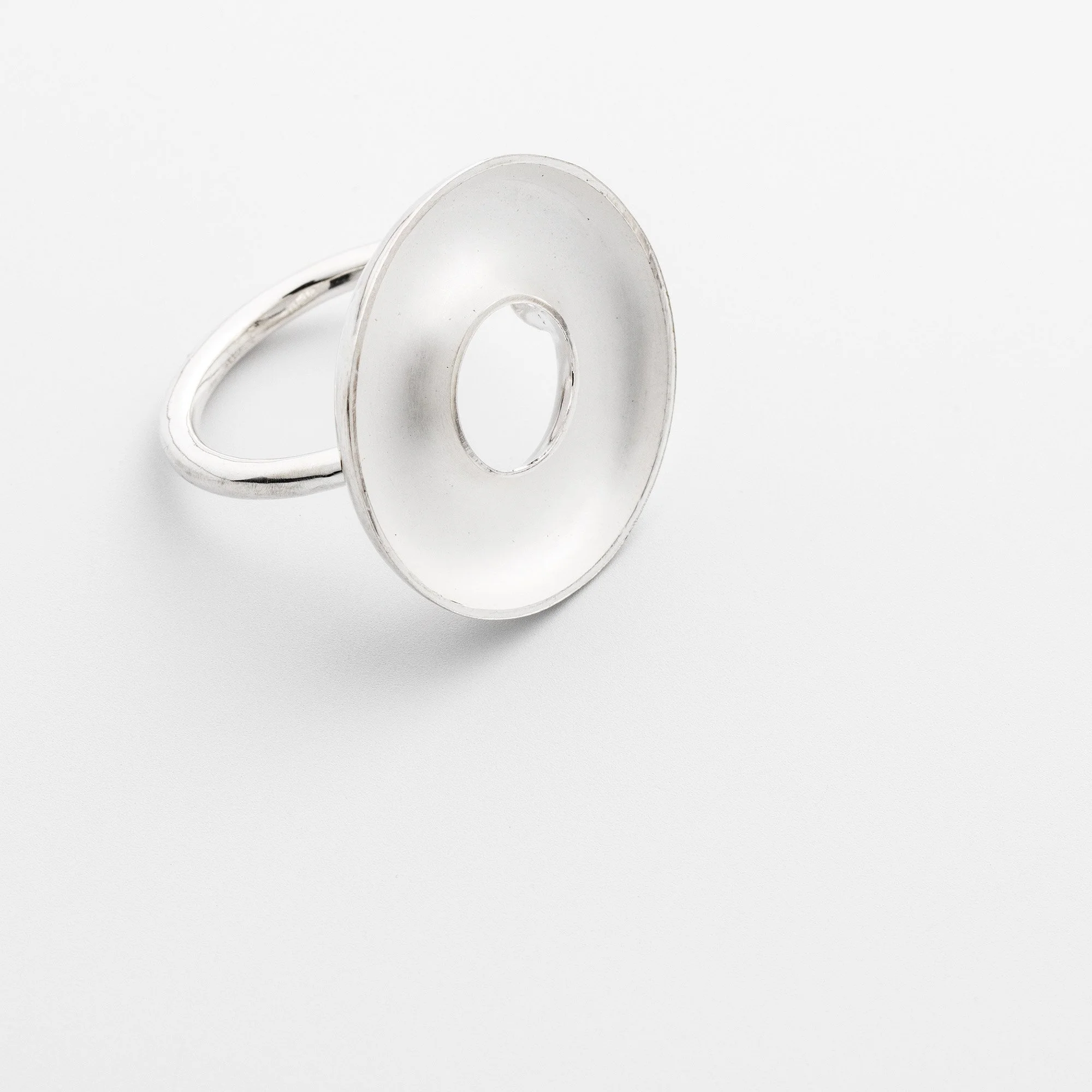 Sterling silver Orbis large ring, concave torus form, polished edge and white interior on round band