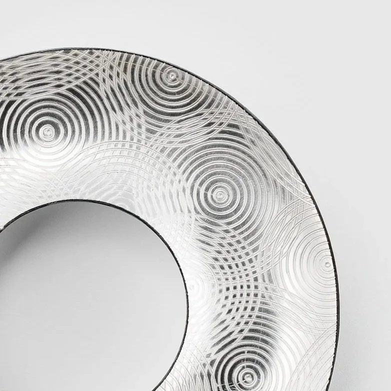 Close-up of Ripples brooch showing engraved concentric circle pattern in sterling silver