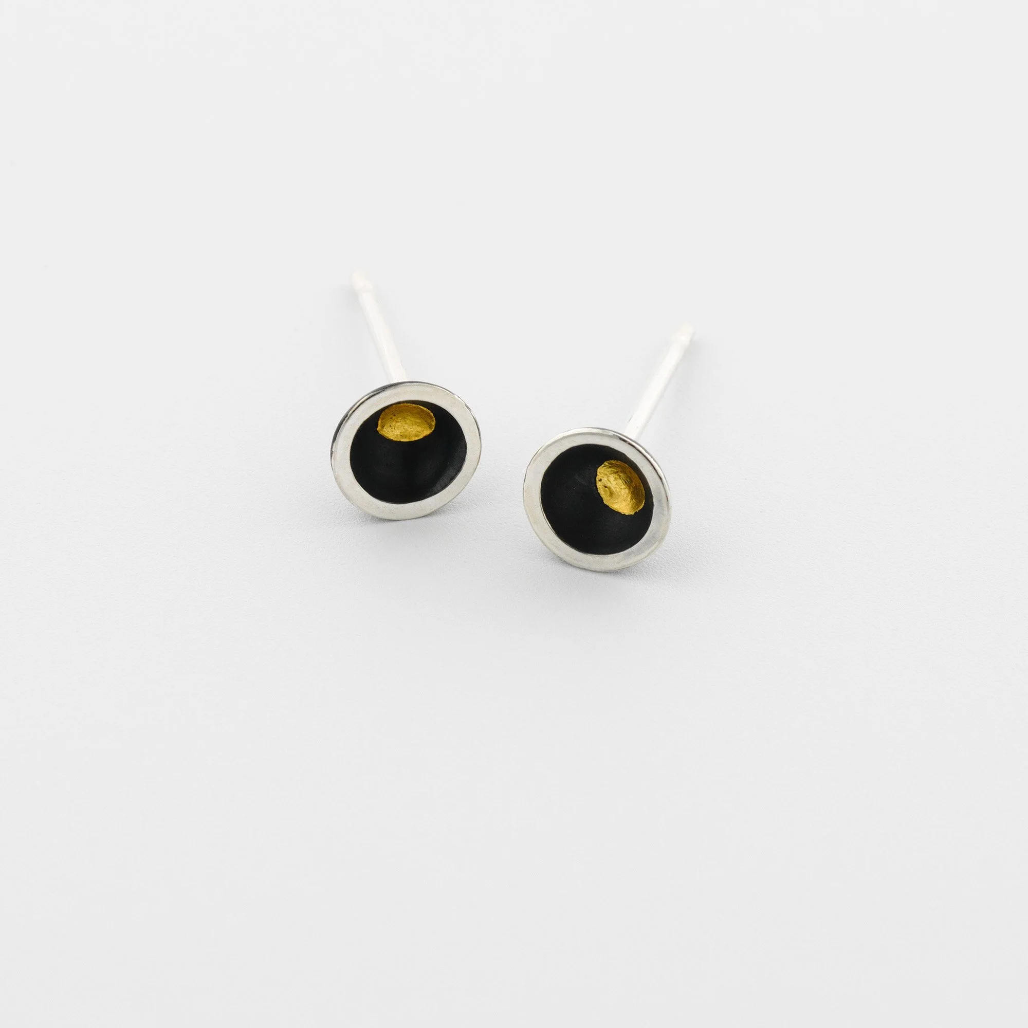 Tiny domed oxidised sterling silver stud earrings with a central gold keum boo dot and polished edges