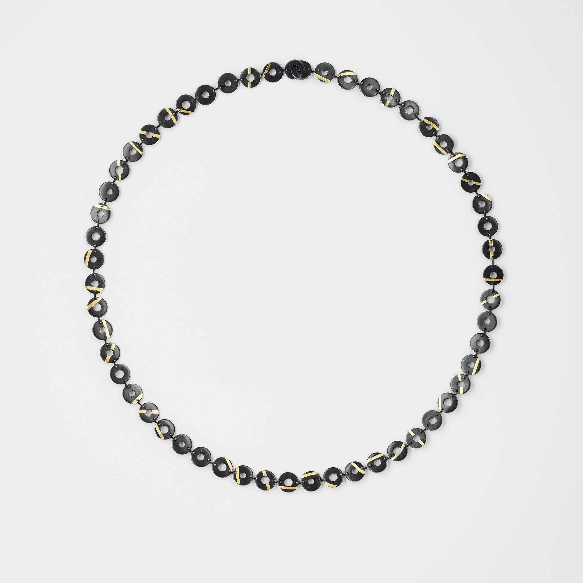 Oxidised sterling silver Chronos necklace, linked flat torus shapes with 24ct gold stripes