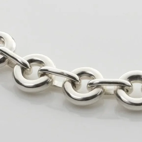 Close-up of Monad Link necklace showing hand-drawn wire torus links