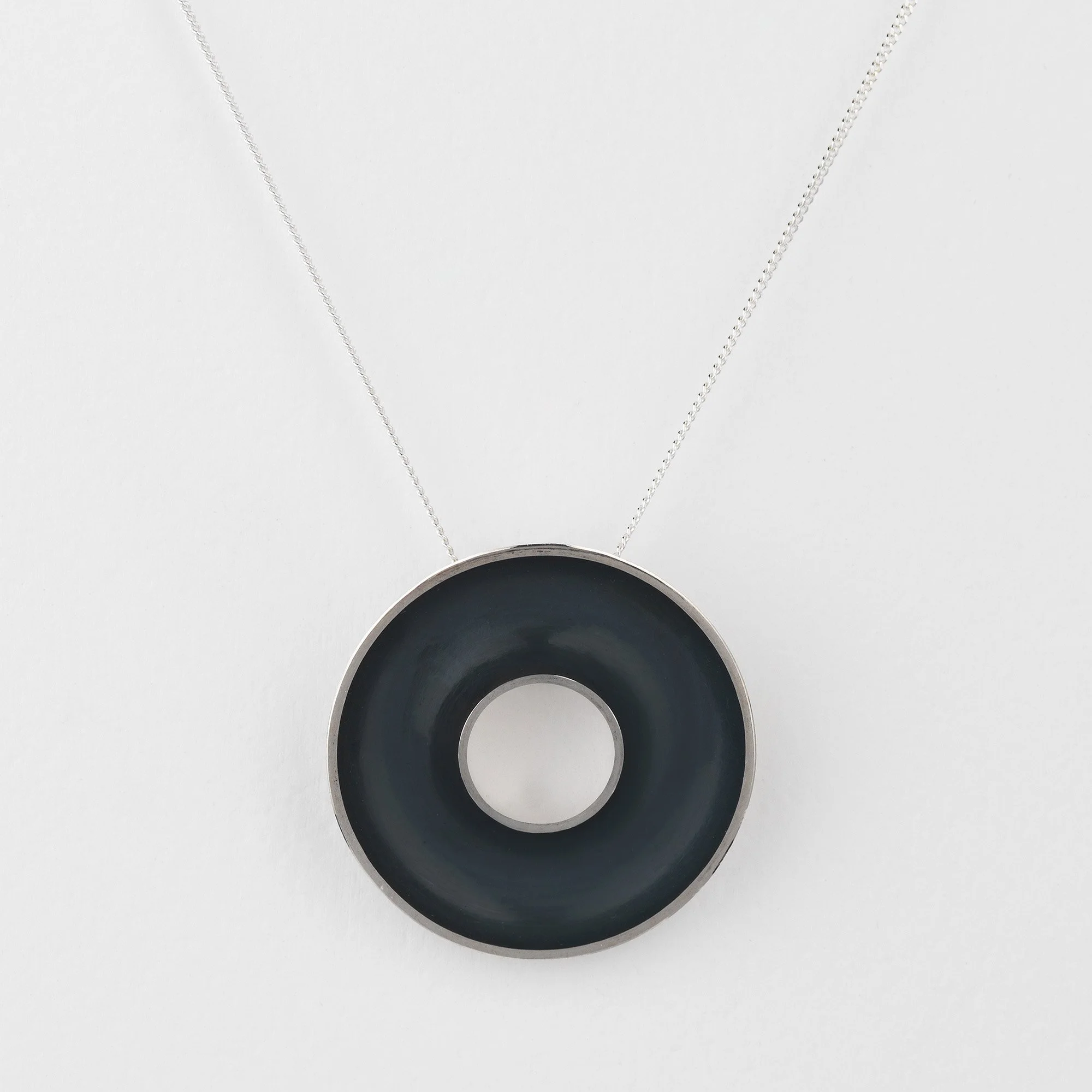 Sterling silver Orbis large necklace, circular, concave torus pendant, polished edge and oxidised interior on curb chain