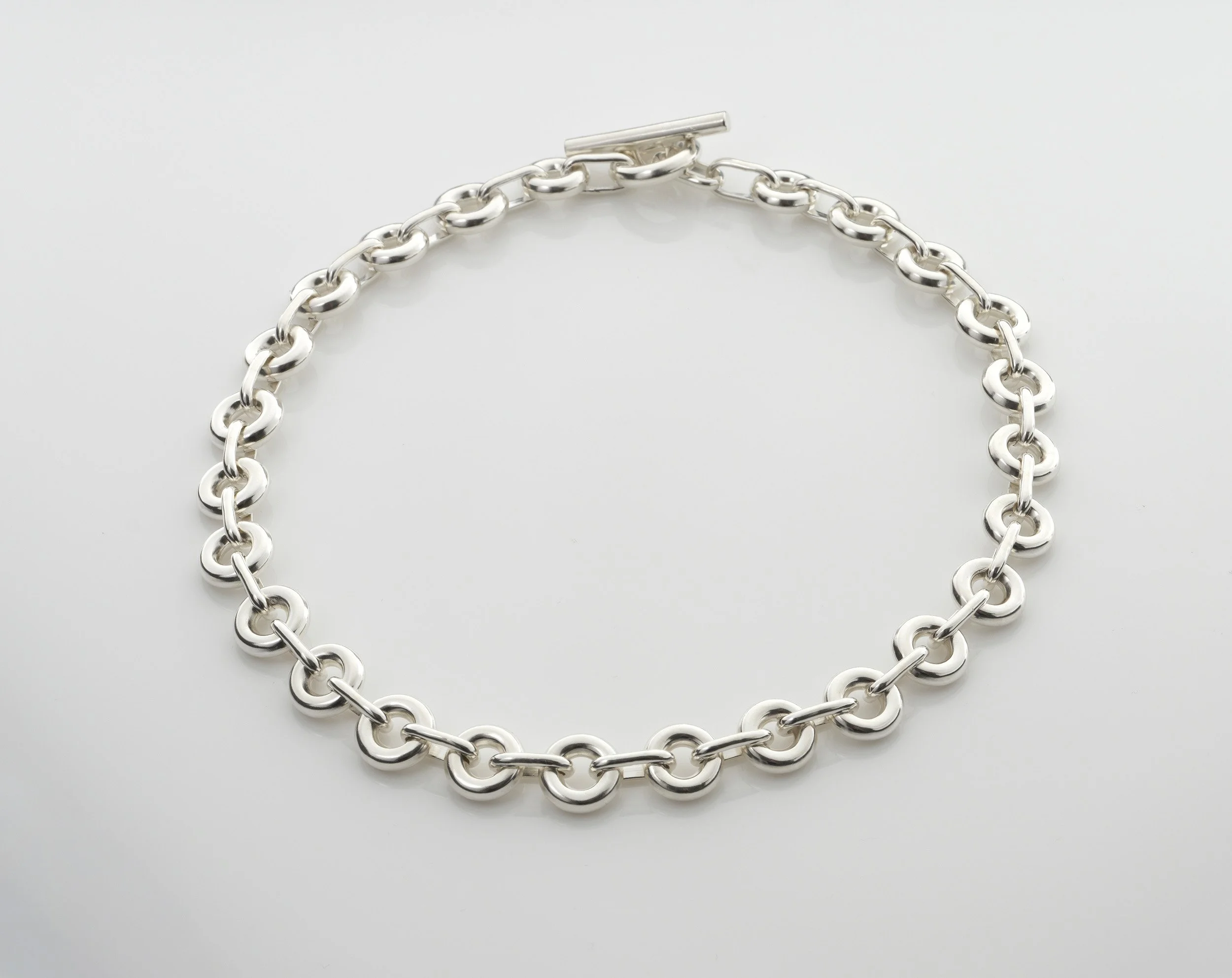 Sterling silver Monad Link necklace, repeated torus links and large T-bar clasp