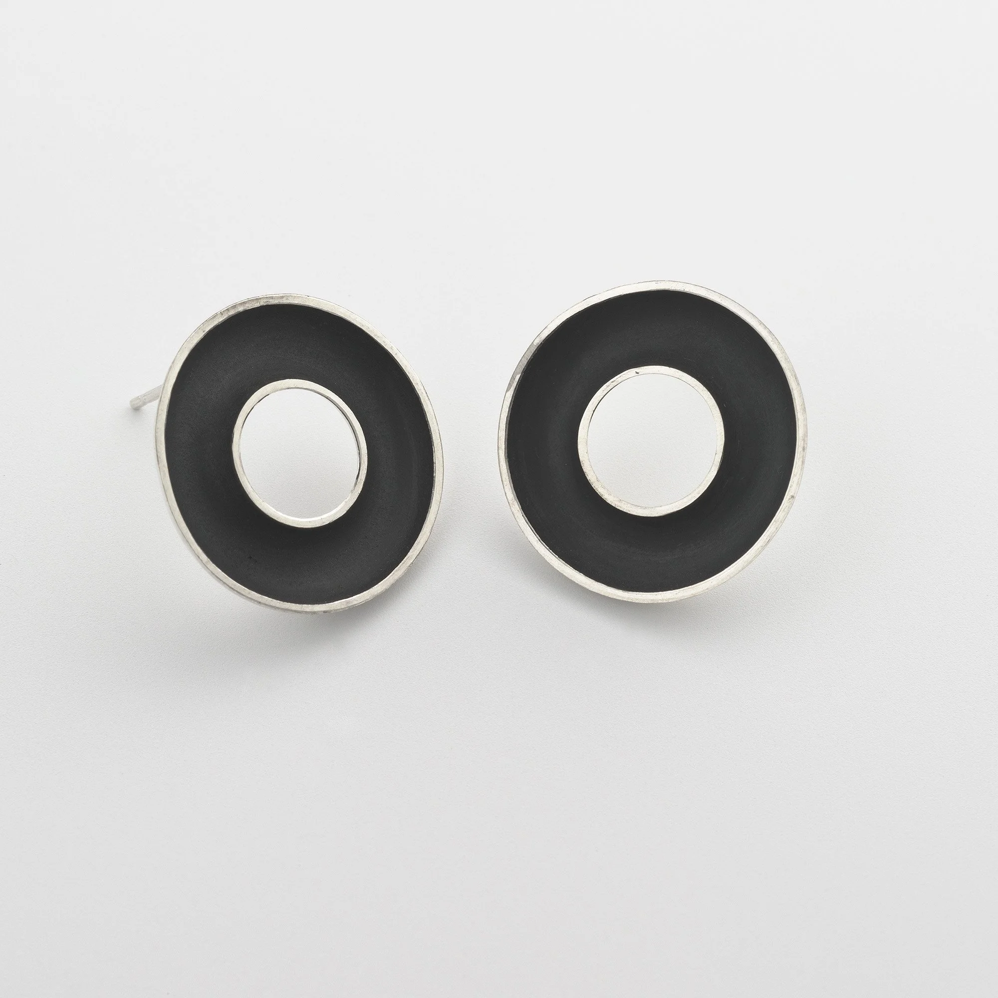 Sterling silver Orbis medium stud earrings, circular, concave torus form, polished edge and oxidised  interior