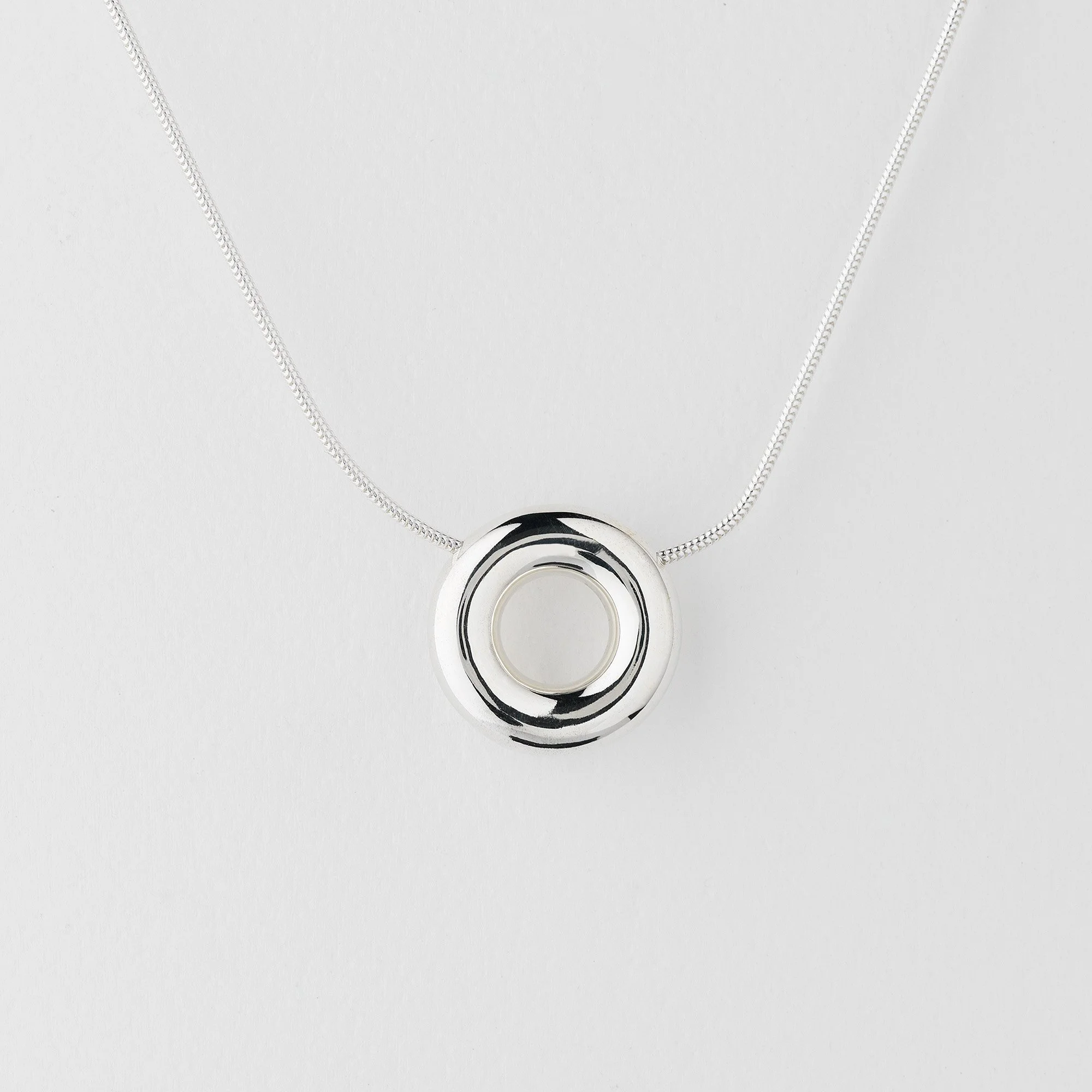 Sterling silver Monad medium necklace, polished circular torus pendant on snake chain