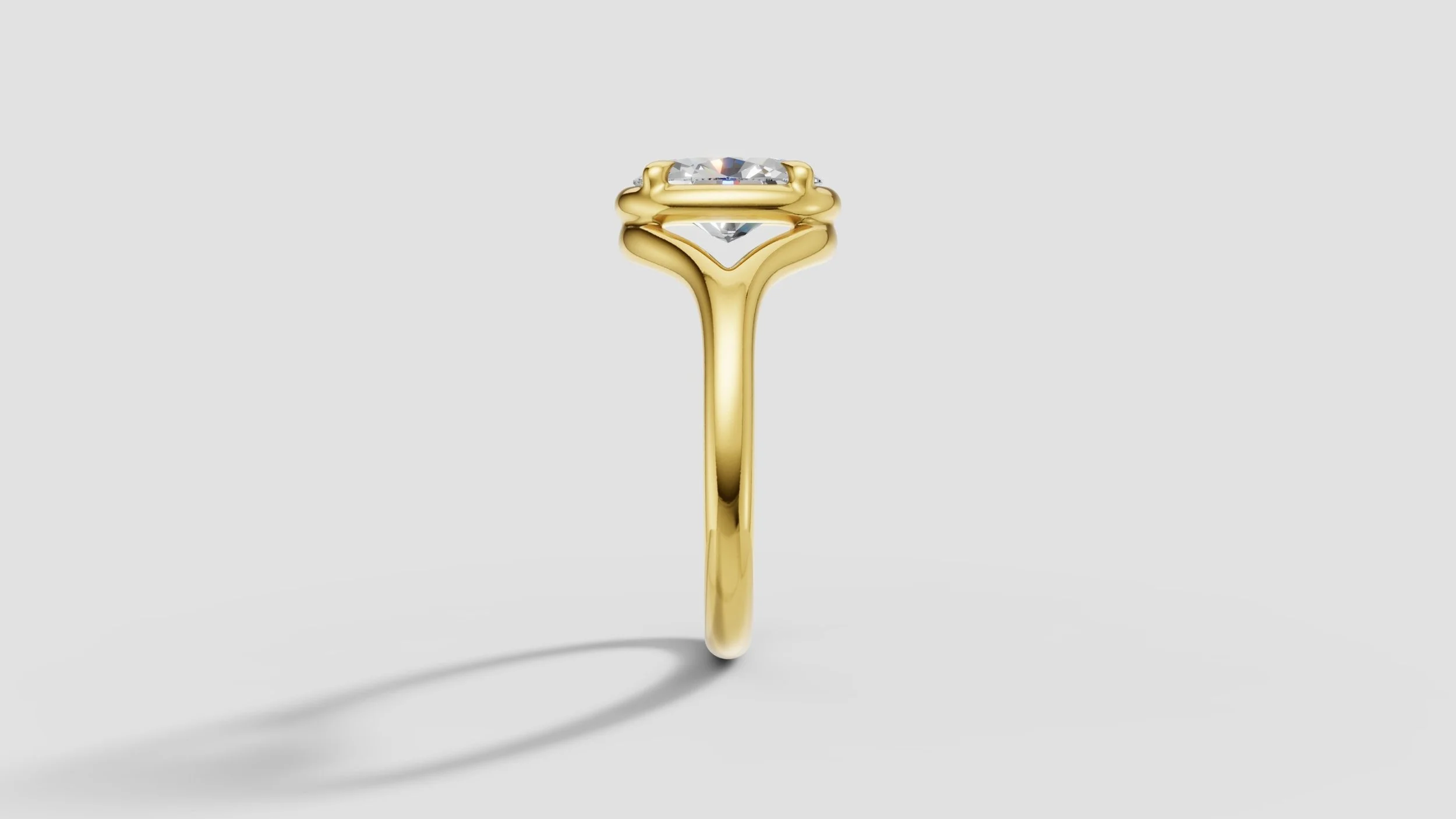 Side view of bespoke 18ct gold ring with oval diamond and flowing split shank design.
