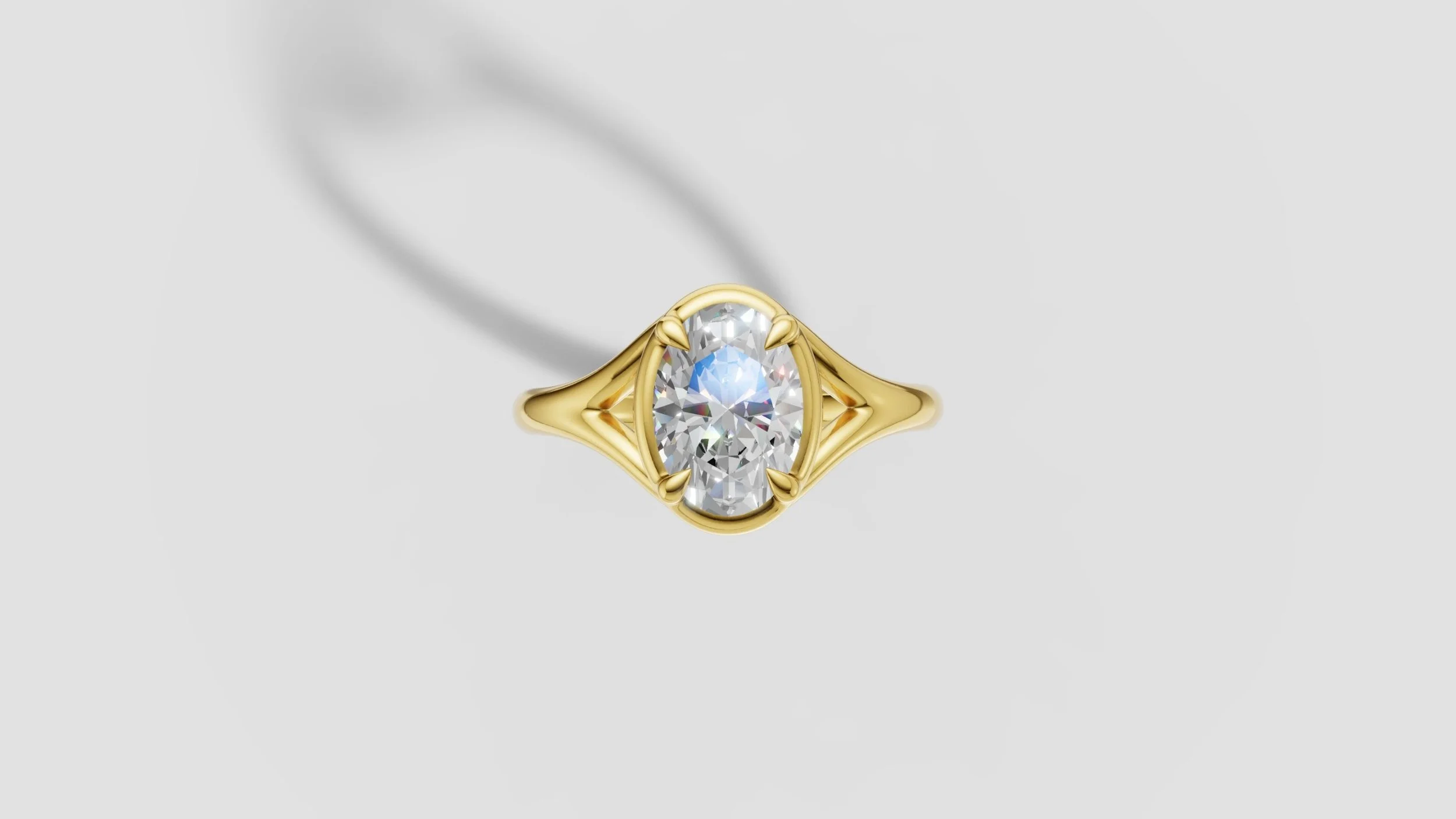 Top view of 18ct gold split shank ring set with 2ct oval diamond in four claw setting.