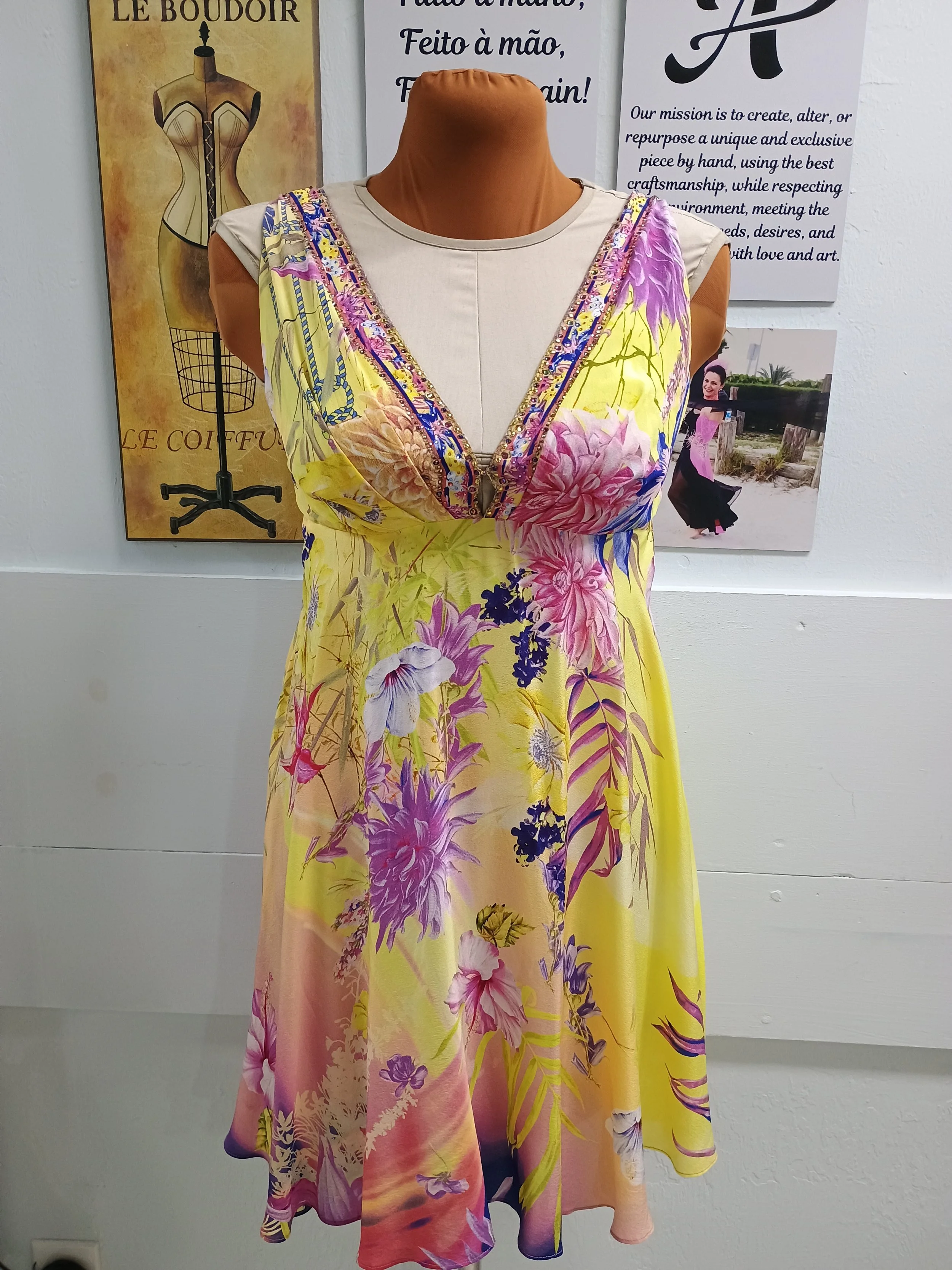 Colorful floral dress on a mannequin.