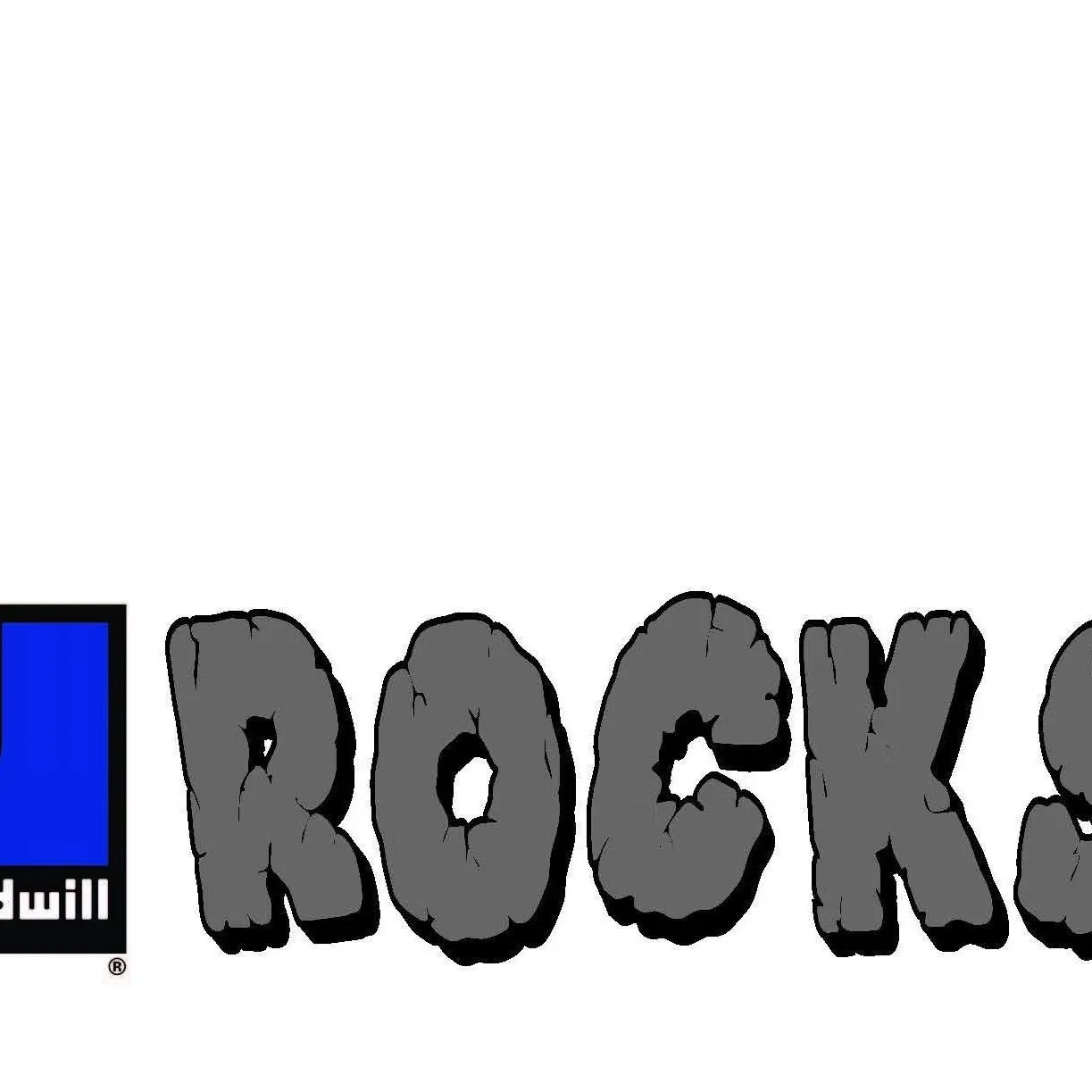 Close-up of the word "ROCK" written in large, black, cracked stone letters with a blue and black logo on the left side.