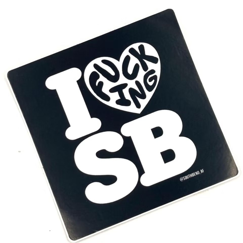A black square sticker with white text that reads "I ❤️ Foxxing SB" with a heart shape around the words "Foxxing" and "SB" below it.