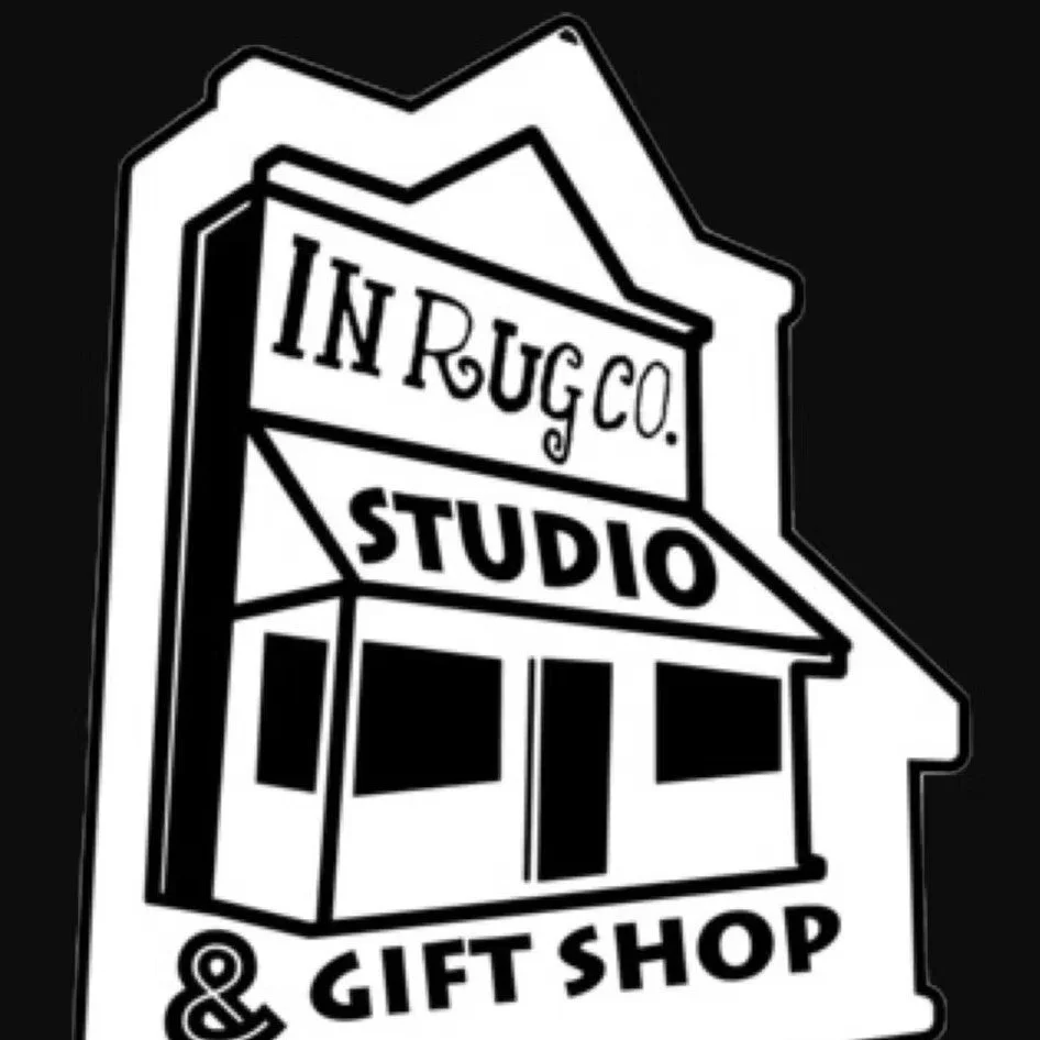 Black and white logo for Inrug Co. Studio & Gift Shop with an illustrated storefront