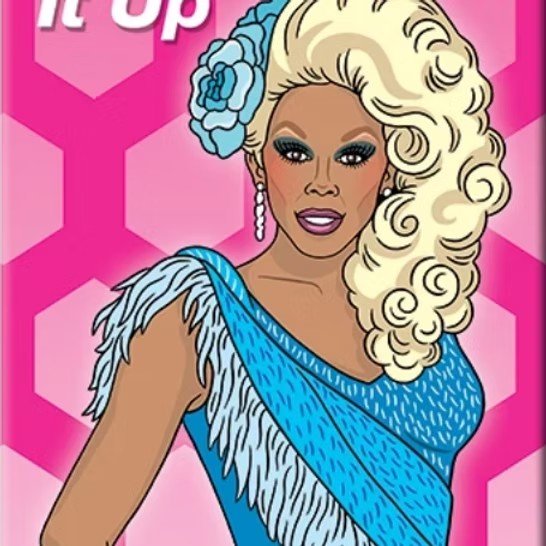 A woman with blonde curly hair decorated with a blue flower, wearing a blue dress with feather-like details on the shoulder, and pink lipstick, standing against a pink geometric background.