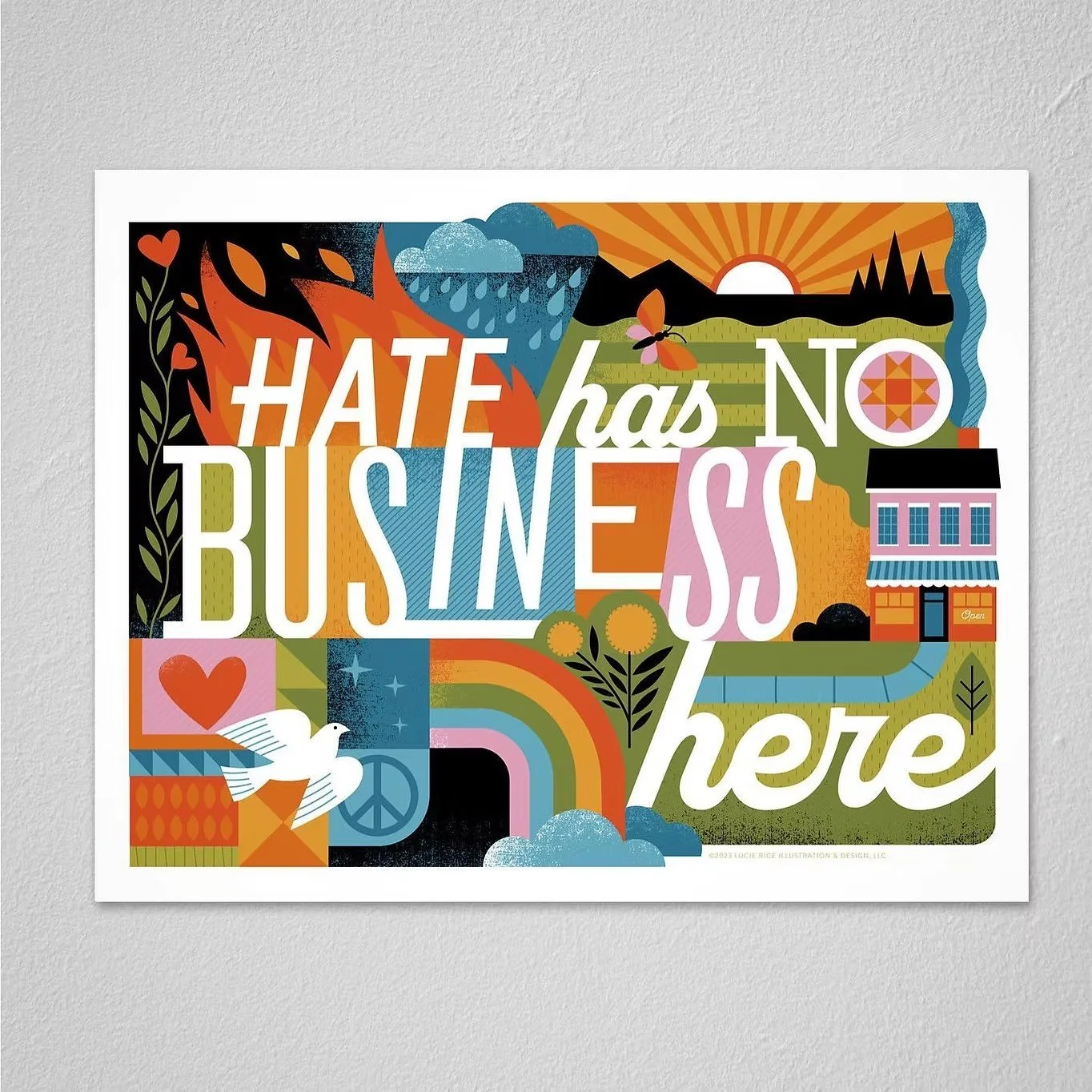 Colorful illustration with the message 'Hate has no business here' displayed in large, mixed fonts. The background features nature elements such as a sunrise, mountains, clouds, rain, a butterfly, a flying bird, a heart, a rainbow, a house, trees, and a peace sign.
