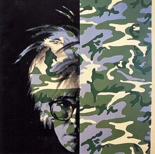 A split image featuring a black-and-white photo of a woman with glasses on the left and a camouflage pattern in shades of green, purple, and beige on the right.