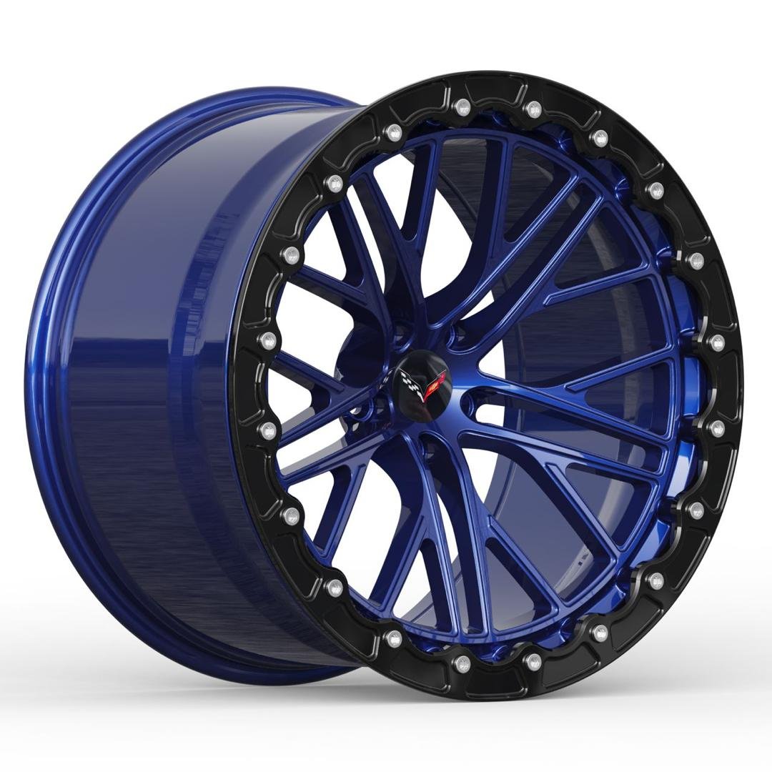 A blue and black car wheel rim with a Chevrolet Corvette logo on the center cap.