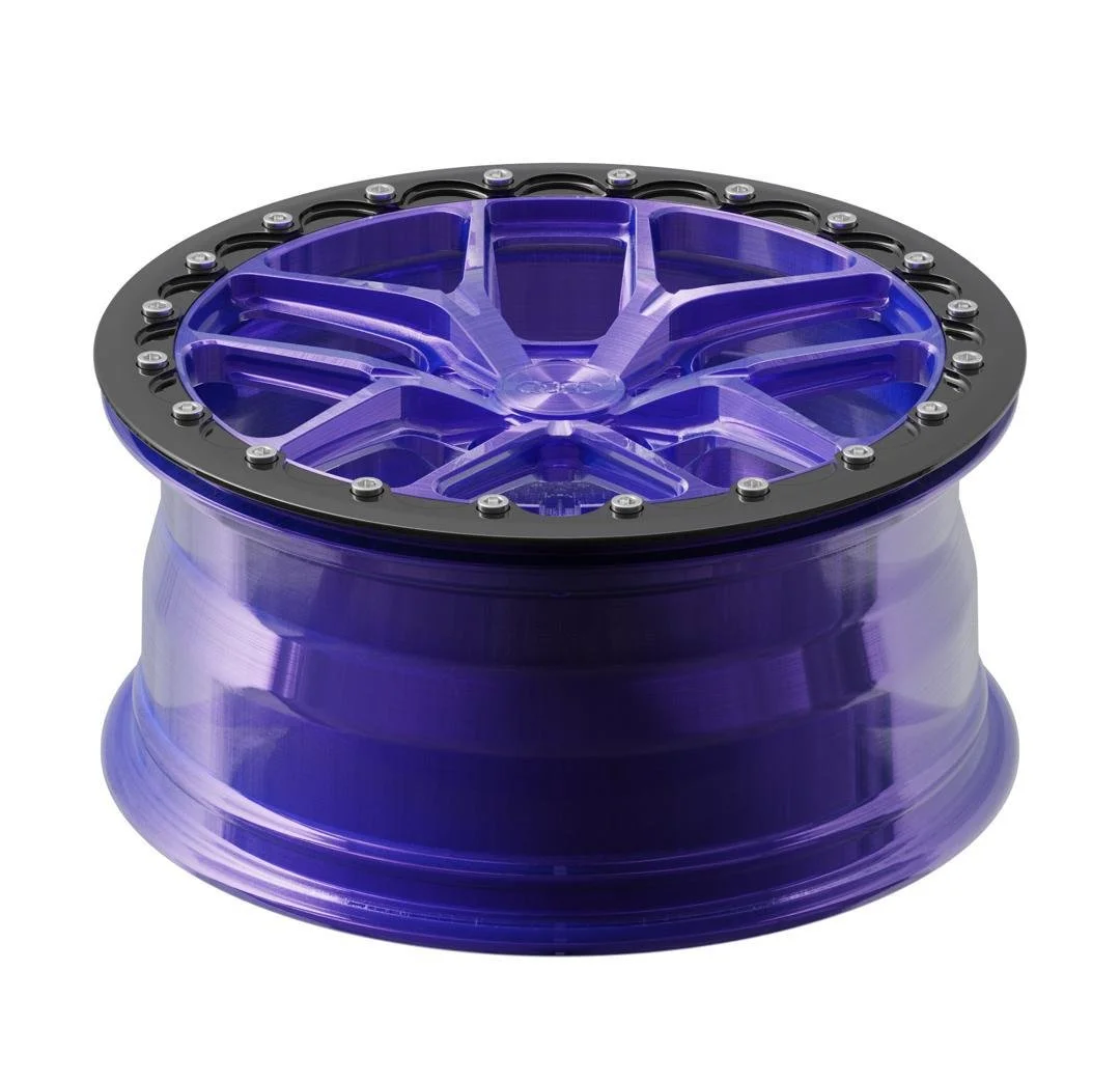 A purple car wheel rim with a black bolt ring around the outer edge.